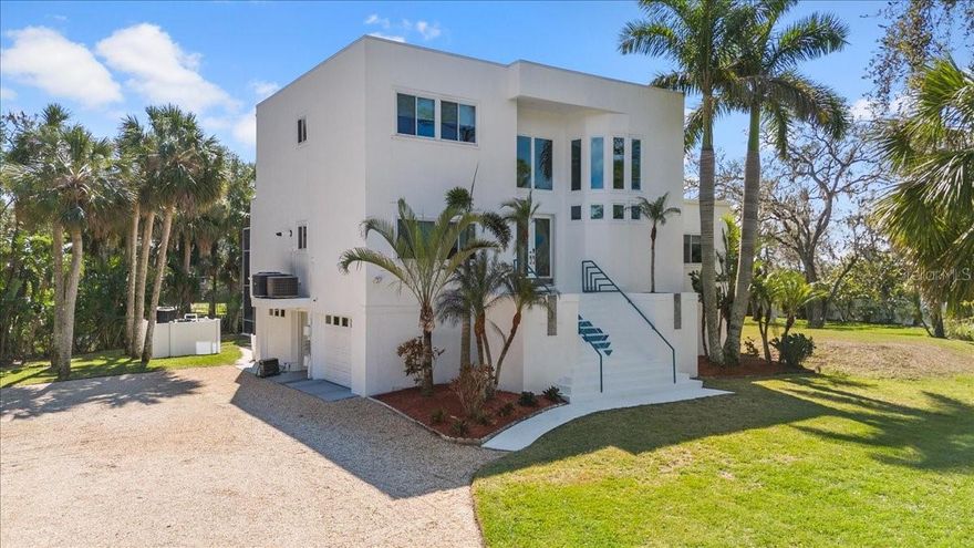 COMPLETE LUXURY MAKEOVER! (Back on market after buyer couldn't get financing) Welcome to your modern dream home! Not a single detail was untouched in this carefully thought out full 2024 remodel. From the baseboards to the designer air vents every detail is impeccably done. The kitchen remodel was a labor of love. Full cabinet replacement with lighted drawers, NEW appliances, High-end Essenza Quartzite waterfall countertops found only in luxury homes is extremely difficult to install and it's flawless done in this gourmet kitchen including full encapsulation of the island. High end tile backsplash, Polished Porcelain 32x32 Onyx tile throughout 2nd & 3rd floors, Heimey designer chrome door knobs, Single panel glass interior doors, Every outlet & light switch is NEW, Jaw dropping modern glass light fixtures and chandeliers all brand NEW. All bathroom cabinets were replaced with modern floating vanities and vessel sinks. SMART toilets, LED mirrors, NEW faucets & drains in ALL bathrooms. Master has triple sided gas fireplace leading to the ensuite featuring a concrete vanity designed by a local artist opposite a free-standing soaker tub & walk-in shower. Staircase is CALCUTTA Sunset Quartz (nicer than most countertops) with floating Frameless glass railings & chrome accents inside and outside on all balconies. The centerpiece of the living area is a one-of-a-kind 20ft tall LED lit accent wall. Modern luxury in the heart of Oldsmar sitting on an ACRE of land. NO HOA. Flood insurance is approximately $800./yr and transferable. Ground floor gameroom/ gym/ flex space out to 1400 sq ft of pavered pool deck & 2 story screen enclosure. Saltwater pool with spillover Spa, OUTDOOR kitchen. A/C (2023), ROOF (2022), ELECTRIC PANEL (2023), HURRICANE RATED WINDOWS & SLIDERS (2017), POOL PUMP (2024), TANKLESS WATER HEATER (2018). Store your boat and RV on your 1 ACRE fully fenced & gated private lot. Close proximity to 3 waterfront parks, PICKLEBALL, boat & kayak launch, fishing pier, restaurants, Tampa International Airport and the most beautiful beaches in the world. Schedule your showing today. This home was meticulously designed and must be seen to be appreciated.