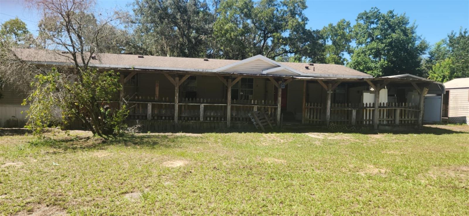 2.26 Acres with a 4 brm 2 bath mobile waitning for you to make it your own. Home has a lovely large porch, up a few steps into a ncie sized living area.. and of course the bedrooms are split plan. The kitchen has so many cabinets you may have trouble filling them all . Laundry is inside for your convenience. There are several outbuildings and some pens for animals on the property along with being fenced. Win Win, no .. No sight unseen offers, No assignables No escalation clauses.