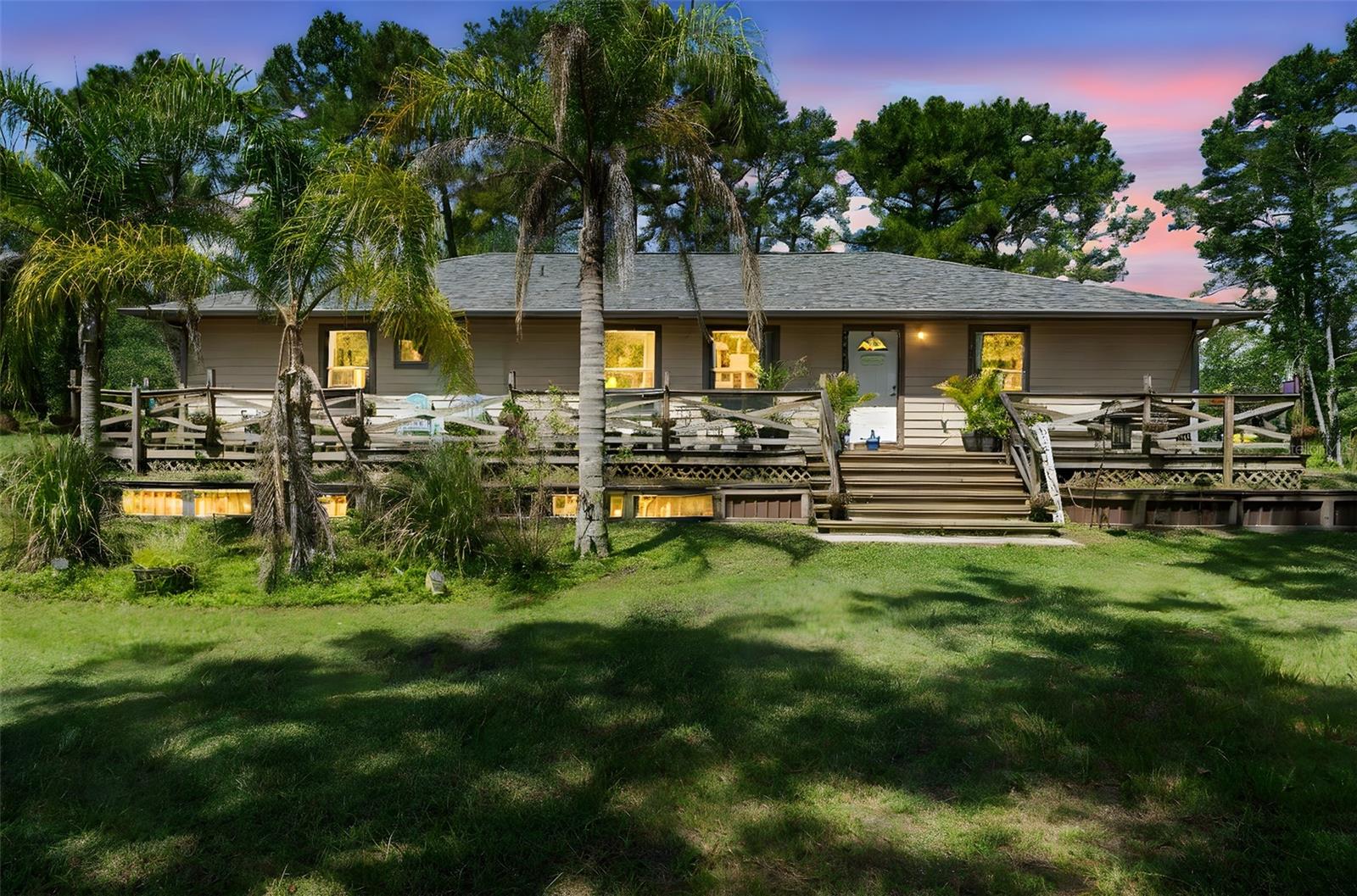 If you’ve been searching for the perfect balance of privacy, space, and opportunity, this 5-acre retreat checks every box. Nestled behind a private gated entry, you’ll find a welcoming 3-bedroom, 2-bath home with a wraparound porch that lets you enjoy sweeping views of trees, palms, and a your 5 Acre estate..
Inside, the open floor plan and tiled flooring create a light-filled, low-maintenance home ready for your personal touch. But the true gem is outside: two sheds plus a massive 4,000 sq. ft. workshop with five bay ports ready for a car enthusiast or project master. Whether you’re into automotive work, woodworking, or running a business from home, this space is unmatched.
All of this is just minutes from I-4, making travel easy while still enjoying the peaceful seclusion of country living with no traffic noise. A rare find for anyone wanting both functionality and tranquility.