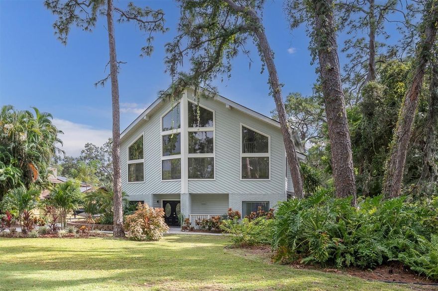 A Rare Gem in the Heart of Seminole - 
This unique and exceptional home is now available — located in one of Seminole’s most sought-after “sweet spots” along 74th Avenue, safely set in an X Flood Zone. From the moment you arrive, the striking full glass-paneled front makes a statement of elegance and class.
Inside, discover THREE STORIES OF INSPIRED LIVING. The main portion of the home spans two floors and features 3 bedrooms, 2.5 baths, and an abundance of thoughtfully designed spaces — including a spacious kitchen, living and dining rooms, utility room, office, and cozy sitting area.
The living and formal dining rooms exude a grand, open atmosphere with CATHEDRAL-STYLE HARDWOOD PAINTED CEILINGS and a touch of modern ambiance from the BUILT-IN ELECTRIC FIREPLACE.
The kitchen has been tastefully remodeled to perfection — boasting custom KraftMaid wood cabinetry, a Zline 6-burner gas stove with matching hood and pot-filler, a center island with Cosmo drawer microwave, quartz countertops, farmhouse sink, wine refrigerator, and stainless steel appliance suite.
The PRIMARY BEDROOM is open, light, and airy — featuring a DOUBLE-SIZED LAYOUT with en-suite bath and walk-in closet. The second floor also offers a half bath, laundry area, and a charming sitting room with FRENCH DOORS LEADING TO THE PATIO, GAZEBO, POOL AND POND.
The THIRD FLOOR hosts bedrooms two and three, both with vaulted ceilings and private balcony access overlooking the tranquil backyard. A SPACIOUS THIRD BATHROOM WITH JACUZZI TUB and an OVERSIZED WALK-IN CLOSET with ATTIC ACCESS for additional storage (connected to Bedroom 2 and accessible through the bathroom) complete the level, along with a 10x14 OFFICE SPACE WITH VAULTED CEILING, built in cabinets, shelving and desk overlooking the living and dining area..
But that’s not all — this home includes a RARE BONUS FEATURE: a FIRST-FLOOR IN-LAW SUITE with IT’S OWN PRIVATE ENTRANCE. This self-contained space includes one bedroom, one bath, a kitchen, dinette, and washer/dryer — ideal for extended family, guests, or rental income potential. A private landscaped patio with awning provides a peaceful entryway to the backyard.
Throughout the home you’ll find 12mm AQUA GUARD LAMINATE FLOORING, 6 PANEL DOORS, 5” BASEBOARDS, and QUARTZ COUNTERTOPS tying the spaces together in timeless style.
Step outside to your own backyard paradise — complete with a 13x25 SALTWATER HEATED POOL WITH FOUNTAIN (installed 2022), PAVER PATIO, 14x10 GAZEBO, 8x10 shed, and even a POND FILLED WITH TILAPIA AND TURTLES! The property also boasts MANGO, AVACADO, PEACH, AND GUAVA TREES — a true Florida dreamscape.
Let’s not forget to mention that this PARADISE OASIS is a 5 MINUTE DRIVE TO OUR BEAUTIFUL SANDY BEACHES WITH STUNNING SUNSETS, just a few blocks from BOCA CIEGA MILLENNIUM PARK,( a 186 acre nature park with a 35 ft. observation tower, boardwalks, playground, dog park and accessible to the Pinellas Trail), close to SEMINOLE SCHOOLS including Richard O. Jacobson and St. Pete College, restaurants and the popular Seminole City Center.