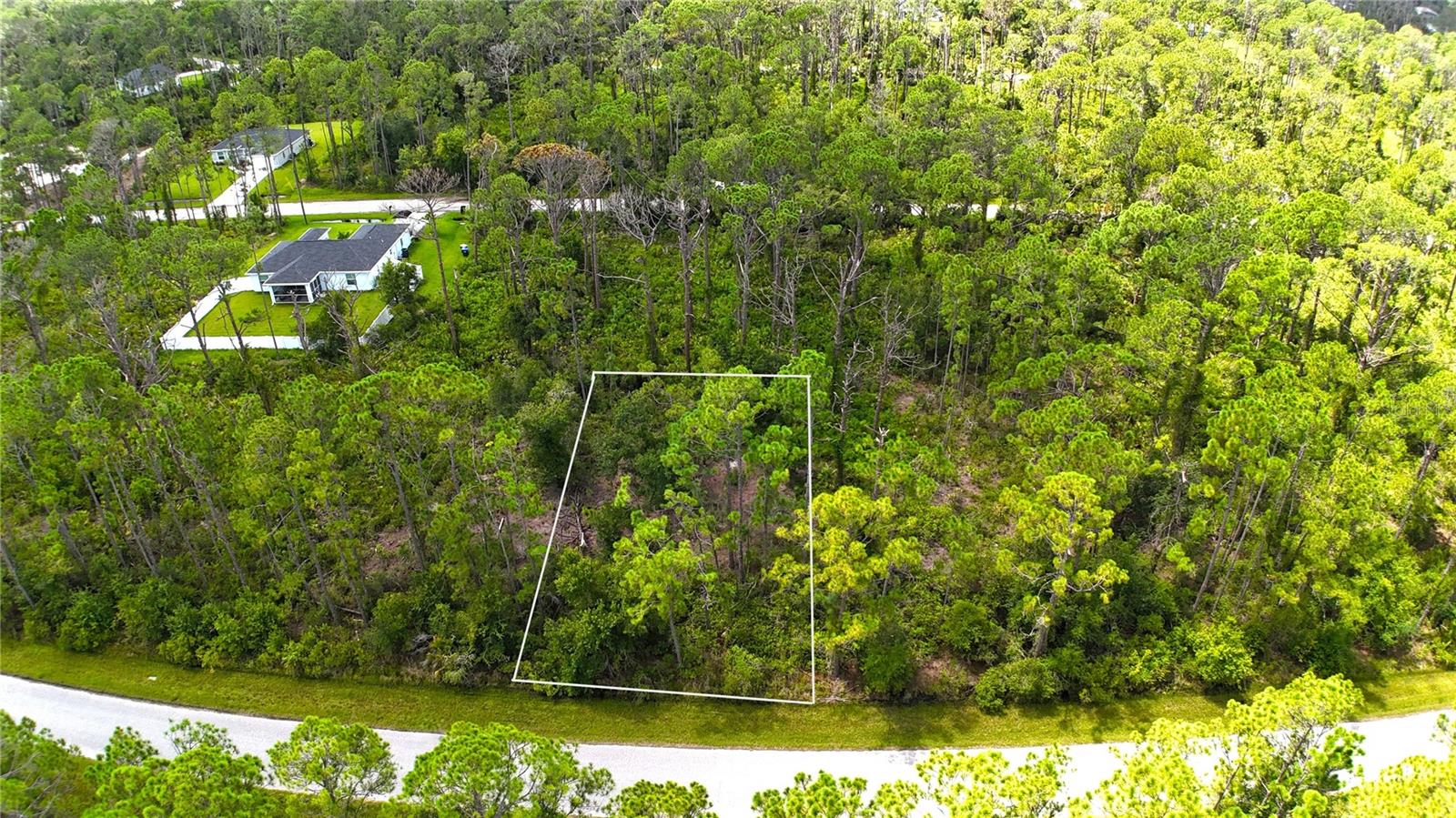 North Port is a growing city with wonderful outlying areas for new homes. This lot is particularly appealing with its location in a quiet country area near North Port Estates yet an easy drive to the beautiful parks and recreation such as the nearby Myakkahatchee Environmental Park, Legacy Trail and the North Port Aquatic Center. Quick access to I-75 via Toledo Blade Blvd. Great schools including Suncoast Technical College. This Southwest Florida area is loved for its year round enjoyment of the Gulf beaches, fishing, boating, swimming and sports including the Atlanta Braves spring training at CoolToday Park. The shopping areas and variety of restaurants are favorite places to gather and enjoy. Lot 16 on Kamsler Ave has just a few homes around it and it is welcoming to know that all future homes will be brand new homes. Build your Florida home on this lot with a southern exposure. Great builders are available to help you design your custom Florida home.