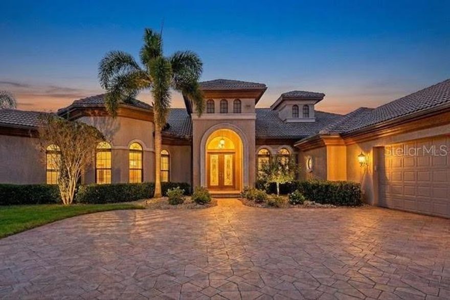 Discover the perfect blend of craftsmanship, comfort, and elegance in this custom-built Arthur Rutenberg estate home, ideally located in The Isles of River Wilderness—one of the area’s most prestigious guard-gated, boating communities. Nestled on an exceptionally private preserve homesite of over half an acre, this residence is thoughtfully designed to capture the true essence of Florida living, complete with stunning water views.

Boasting approximately 4,300 square feet of refined living space, this impressive home features striking curb appeal and an oversized three-car garage. Upon entering through the grand double doors, you are immediately greeted by breathtaking estate and water views, setting the tone for the home’s sophisticated design, high-end features, and quality finishes throughout.

The home offers four spacious bedrooms, each with its own en-suite bath and custom-built closets, ensuring comfort and privacy for family and guests alike. A dedicated office provides the perfect space for work, study, or leisure.

The chef’s kitchen is a standout, equipped with GE Monogram stainless steel appliances, abundant cabinetry, a massive granite center island, and a Butler’s pantry complete with a wine refrigerator—ideal for entertaining. The great room showcases floor-to-ceiling sliding glass doors, flooding the home with natural light and offering seamless indoor-outdoor living with spectacular private views from nearly every room.

Step outside to your own personal resort. The expansive, caged lanai features multiple seating areas, a wood-burning fireplace, outdoor kitchen, spa, and a stunning pool—perfect for relaxing or hosting unforgettable gatherings.

This exceptional estate offers luxury, privacy, and lifestyle in one remarkable setting. Come experience it for yourself and fall in love with your new home.