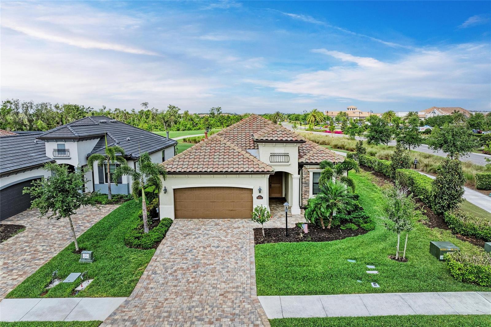 SPECIAL HOLIDAY PRICING! If you are seeking a dynamic yet refined lifestyle, Look No Further! This never been listed before spacious single-family Lakewood Ranch home is on a desirable corner lot with a full golf course view. Offering four bedrooms, two baths with 2,248 interior square feet providing easy, relaxing and carefree living in the gated community of Lakewood National Golf Club. The Isabella floor plan showcases an open-concept design with a split-bedroom layout, providing privacy and flow. Interior highlights include custom paint, crown molding, Hunter Douglas blackout blinds and ceiling fans in each bedroom, living room and patio. The kitchen features a natural gas range, built-in wall oven, generous pantry and abundant cabinet storage. The oversized primary suite includes two walk-in closets and plenty of natural light. Enjoy Florida’s indoor-outdoor lifestyle from the screened lanai, complete with an outdoor kitchen and amazing light all day. The two-car garage and proximity to resort-style amenities enhance the home's appeal. All this, plus owners in Lakewood National Golf Club enjoy deeded golf membership giving owners the ability to play 36 holes of championship golf year-round. The Commander course at Lakewood National Golf Club was named No. 1 Golfers’ Choice and No. 1 Top Course in Florida by Golf Advisor. Lakewood National Golf Club offers gated, maintenance-free living with extraordinary amenities that include 36 holes of Arnold Palmer-designed golf courses, a zero-entry heated pool with cascading waterfalls and lap lanes, poolside tiki bar and café, fitness center with group exercise classes, an on-site full-service spa, eight lighted Har-Tru tennis courts, bocce, pickleball, several satellite pools, and a stunning 28,000-square-foot clubhouse which offers fine and casual dining, an expansive bar and lounge, men’s and ladies lounges and locker rooms, conference and meeting space, a full-time lifestyle director who keeps residents’ social life fun and active with trivia night, karaoke night, live concerts on the green, extravagant holiday parties, wine-tasting dinners and more. Lakewood National Golf Club hosts the annual Korn Ferry Tour’s LECOM Suncoast Classic. Schedule your private showing today, move-in ready and flexible terms.