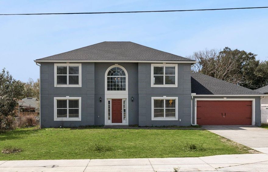 Welcome to this beautifully remodeled 4-bedroom, 2.5-bathroom home offering over 2,300 square feet of modern living space in the heart of Deltona Lakes with a NEWER Roof (2024). Behind its classic two-story exterior, this home opens to a beautifully refreshed interior designed for modern living. The interior has been thoughtfully updated to create a bright, modern feel with a neutral color palette and wide-open floor plan perfect for today’s lifestyle. The stylish kitchen features white shaker-style cabinetry, granite countertops, sleekappliances, and a pantry, all overlooking the main living spaces for seamless entertaining. Large ceramic tile flooring designed to resemble wood planks flows throughout the first floor, while durable vinyl plank flooring upstairs adds warmth and continuity. A formal dining room, spacious living areas, and a convenient half bath on the main level make the layout both functional and inviting. Upstairs, you’ll find generously sized bedrooms, including a comfortable primary retreat. Step outside to a large backyard with endless possibilities—create your dream outdoor oasis with a pool, fire pit, outdoor kitchen, or entertainment space designed exactly to your taste. Location is everything, and this home delivers. This home offers a prime Central Florida location just a short drive to the sugar sand beaches of New Smyrna Beach, while also providing quick access to I-4 for an easy commute to Orlando, Lake Mary, Sanford, and Daytona Beach. Enjoy the perfect balance of coastal living and city convenience with shopping, dining, parks, and recreation all nearby. Move-in ready, beautifully updated, and ideally located—this Deltona Lakes home is ready to welcome its next owner.