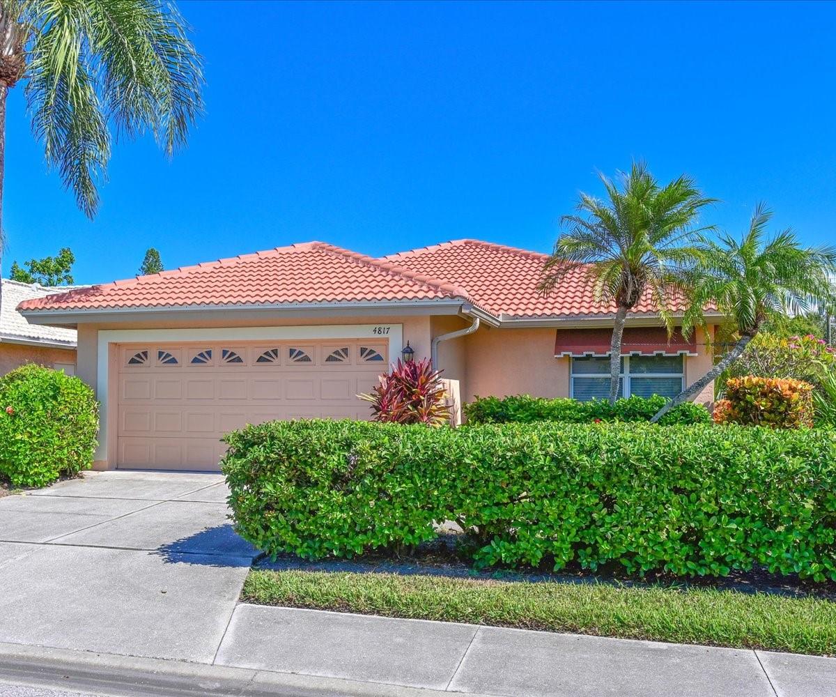 Exceptional West Bradenton location! Walk to shopping, restaurants, banking, and much more. Close to beaches, IMG Academy, two hospitals, and medical facilities. Beautifully maintained lawns and common areas, plus low HOA fees make Highland Lakes a popular place to live. Not a 55 plus community. Allows large pets. Clubhouse and pool. New roof in 2023, new AC in 2024, new hot water heater in 2025, new garage door opener 2025. Windows replaced throughout with hurricane windows. Split 2BR 2BA floor plan, Den, Dining Room, Living Room, Enclosed Lanai. High 10ft ceilings in living room, dining room, lanai, and primary bedroom. Primary bedroom has large walk-in closet. Kitchen has eat-in area. Two-car garage with laundry area in garage. Back yard is private with no homes behind you. Low quarterly fee of $780 a quarter. Fee includes lawn maintenance, fertilization, irrigation, bi-annual tree trimming, cable, internet, clubhouse, pool maintenance, and C and S management. Easy to preview, show today.