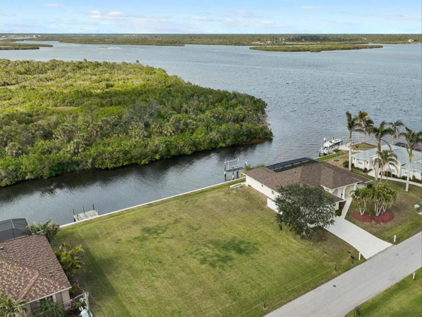 Waterfront Lot, On the banks of the scenic Myakka River with direct boating access to Charlotte Harbor and the Gulf of America. Lot is considered Oversized .28 acre, 12,250 sq. ft. 98' x 125' with Concrete Seawall. 3 lots in from the Myakka River. Cleared and ready to build. Gulf Cove Community Port Charlotte offers a volunteer association that include a community park with boat ramp & parking, very low annual dues.
What a view, what a location. No homes across the canal so quiet and privacy plus. Dead end street, so no thru traffic. This location offers numerous private and public Golf Courses, shopping, hospitals, restaurants, churches and more and we'd like to boast about our Boca Grande World Class Tarpon Fishing Tournament and our stunning sandy beaches plus boating, fishing, shelling and magnificent Sunsets! Come see and ask agent for preferred local reputable builders.