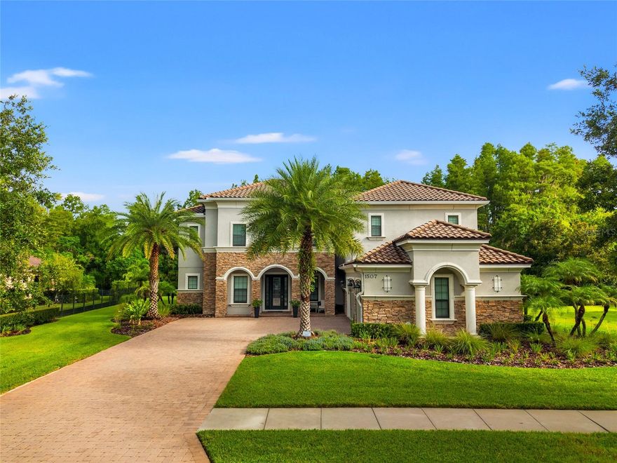 Welcome Home! This exquisite home in the exclusive gated community of Ladera, where luxury meets comfort on a private 0.61-acre conservation lot. Zoned for A-rated Steinbrenner High and just minutes from the Veterans Expressway, this 5,412 sq ft estate offers an incredible lifestyle both inside and out.
Step through the front door and you’re greeted by wide-plank engineered wood floors that flow throughout the home. Off the foyer, a dedicated office with tray ceiling offers a quiet place to work. The formal dining room is spacious, with its own storage closet, perfect for hosting dinner parties and holidays.
The heart of the home is the chef’s kitchen, featuring double islands with sinks and disposals, GE Profile appliances, a gas cooktop with pot filler, double ovens, microwave, refrigerator, large walk-in pantry, wet bar, and a convenient drop zone. It opens to a large family room, pre-wired for surround sound and filled with natural light from oversized sliders that lead to the lanai.
Step outside and you’ll feel like you’re on vacation. The custom saltwater pool and spa feature a sun shelf, gas heater, Wi-Fi automation, and a Nebula lighting system built into the pool cage. The outdoor kitchen is fully equipped with DCS appliances, including a gas grill with rotisserie, dual-tap kegerator, fridge, ice maker, and a cement tile backsplash. A Valor gas fireplace adds ambiance, while wide-span panoramic screens frame peaceful conservation views. There’s even a turf play area, multiple ceiling fans, and a large storage closet for all your outdoor gear.
Back inside, a full pool bathroom features large porcelain tile, a towel closet, and a spacious walk-in shower. One of the five bedrooms is set up as a home gym with rubber flooring (equipment optional), while the others feature walk-in California Closets. Upstairs, enjoy a game room with a large wet bar, sink, and wine fridge, plus a separate media room already pre-wired for theater surround sound.
The owner’s suite is a retreat of its own with a tray ceiling, dual California Closets, a separate linen closet, and a spa-like bath complete with rain shower, handheld spray, showerhead, shower bench, and oversized porcelain tile.
The oversized laundry room offers GE washer/dryer on pedestals, a deep utility sink, and custom mudroom storage. The 3.5-car garage includes a water softener hookup, gas heater, and full-size fridge option, along with plenty of room for storage or toys. Even the driveway has been widened with pavers for extra space and style.
Smart features include Wi-Fi patio audio, automated sprinkler system, spotlights, surround sound wiring, and remote pool controls, Invisible pet fence system.
This home is move-in ready, packed with upgrades, and built for the way you want to live. Come experience the perfect blend of elegance, function, and fun.