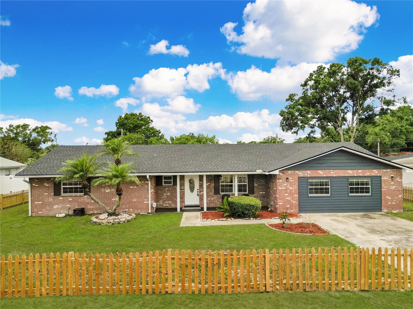 Unbelievable opportunity to own a large home in the highly desired south Lakeland area with an oversized lot and no HOA at an affordable price. You will fall in love with this beautifully renovated 3-bedroom 2-bath home, that blends modern and functional design concepts. Leave your worries at the door as all the big ticket items have been recently replaced, AC 2019 water heater in 2020, roof in 2022. You'll notice the great curb appeal as you pull into the driveway. The covered front porch makes the perfect place to sit and have an evening drink after a long day. When you open the front door you are welcomed with an open and inviting floor plan. A large great room flows seamlessly into the kitchen making this home perfect for entertaining. There is ample countertop space to display snacks for all your friends and family as they visit. The kitchen has been completely remolded with quartz countertops and stainless steel appliances. Wood look tiles throughout the home add a touch of class and make the flooring easy to maintain. The oversized laundry room features washer, dryer, laundry sink and plenty of extra space. A converted garage gives you a flex space to make your dreams come true. man cave, craft room, game room, pool table, make the 400+ sqft space fill your heart's desire and finish it off any way you like. The bathrooms have been recently remodeled to match and give you a modern look with white subway tile showers. You’ll have a great outside area to avoid the elements with a large screened in lanai, while the fully fenced oversized lot gives you plenty of space to play outdoor games and enjoy time with your family members. There are 2 sheds in the back yard which provide plenty of storage and one of which has power and will make a perfect workshop. The property is located in a well established neighborhood close to Scott Lake Elementary and is zoned for Lakeland Highlands & George Jenkins for middle & high schools. Here you will be close to great shopping and dining locations in Lakeland and the Polk parkway which make a short trip to the beaches of Tampa or theme parks of Orlando. Make your appointment quickly, this one is priced to sell fast.