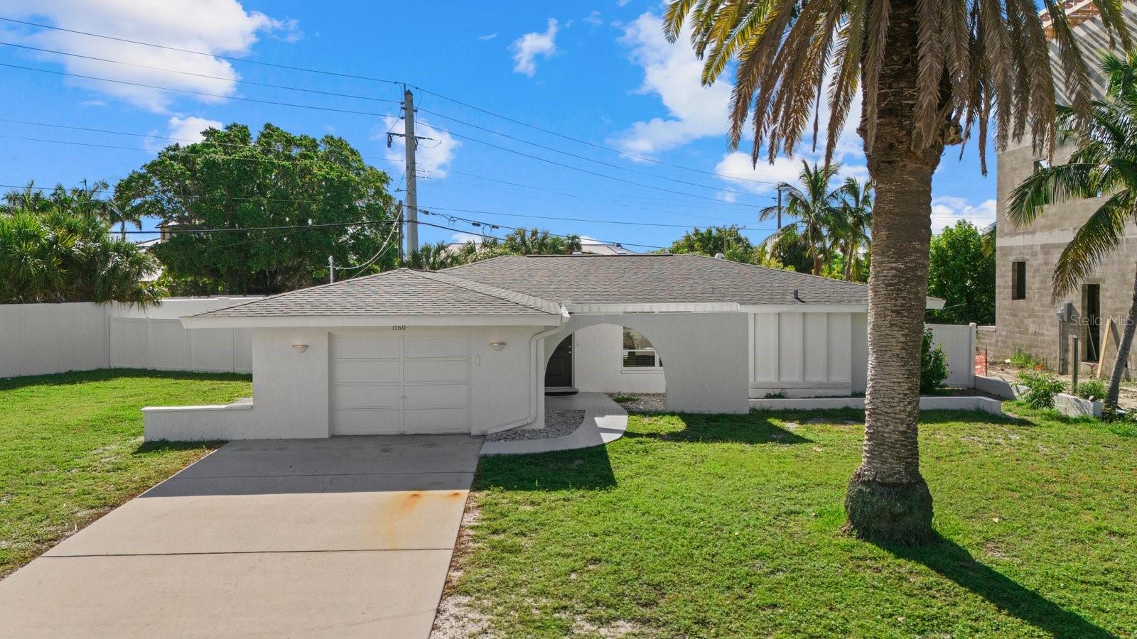 SELLER FINANCING AVAILABLE. Welcome to your dream retreat! This charming 2 bedroom 2 bath home with bonus room offers a unique blend of comfort, style, and coastal allure. Nestled in the serene location of the coveted Lido Shores neighborhood with exclusive private community only beach access and close proximity to the world famous St. Armands Circle, this residence is perfect for both relaxation and entertaining. Step inside to discover a bright and airy open concept living space, where the natural light floods through large windows. The gourmet kitchen boasts stainless steel appliances and quartz countertops, perfect for preparing meals or enjoying casual dining. Adjacent to the kitchen, the dining area opens up to a charming patio, ideal for alfresco meals and enjoying the coastal breeze. The master suite is a tranquil oasis, complete with a luxurious en-suite bathroom. An additional bedroom and bonus room are thoughtfully designed to offer comfort and privacy for family and guests. Step outside to your own private slice of paradise. The expansive backyard is perfect for outdoor gatherings where you can enjoy sunbathing in your refreshing pool. Or if you prefer, simply take a short stroll/drive to your private community gated beach access on north Lido beach. This home is the perfect spot for unwinding after a day at the beach. Additional features include a dedicated laundry room, and a .32 acre corner lot with privacy wall. New roof in 2024, new AC in 2023, and pipes lined in 2024. This property seamlessly combines the best of beach neighborhood living with modern conveniences, offering an unparalleled lifestyle. Schedule a showing today and experience the ultimate in island living!