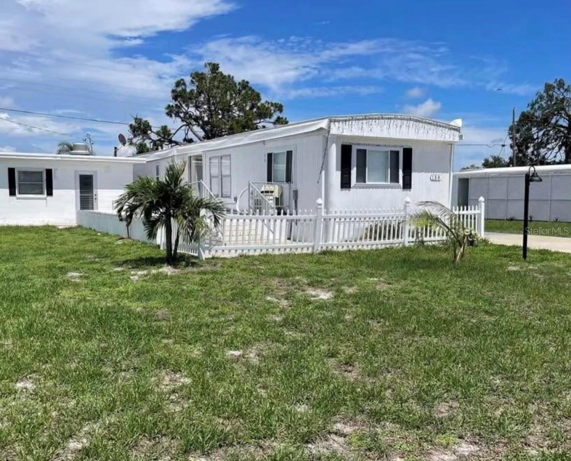 DISCOVER MOBILE GARDENS! Waterfront community with two boat ramps and access to ICW and Gulf via Oyster Creek. Located close to everything in Englewood - shopping, restaurants, hospital, medical offices, parks, golf, trails and 10 minutes to the beach! Optional low HOA fee ($175/yr) provides access to residents-only boat ramps and boat docks are available for an additional fee on first-come first-served basis. Popular community with clubhouse, social events and shuffleboard courts. Enjoy Florida living with your friends! This property is well maintained with a new roof (with transferrable warranty), new 3-Ton HVAC unit and low-maintenance laminate flooring throughout. Bring your boat and make the most of waterfront living in an established community!