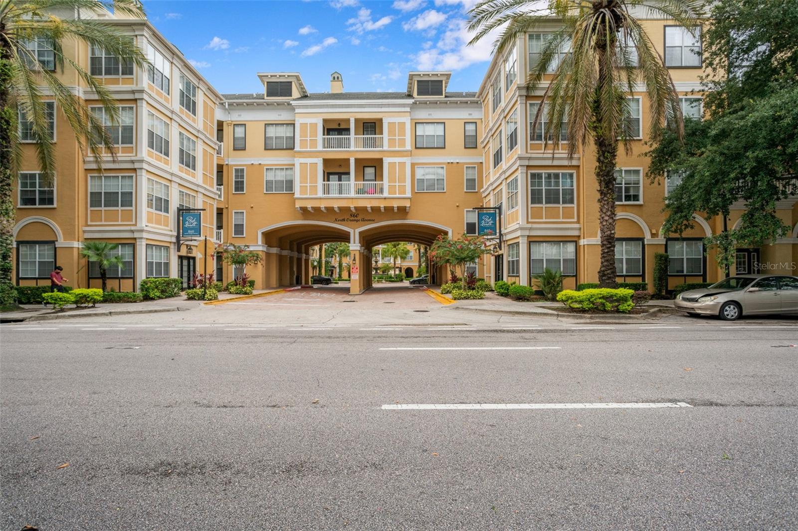 **This house comes with a REDUCED RATE through the seller's preferred lender. This is a lender-paid rate buydown that reduces the buyer's interest rate and monthly payment.** Welcome to a beautifully updated 2-bedroom, 2-bathroom ground-floor condo offering 1,070 square feet of stylish, functional living in the heart of downtown Orlando, complete with one assigned parking space. From the moment you step inside, you’ll notice thoughtful designer touches like crown molding and a blend of luxury laminate flooring in the bedrooms (Pergo Plus—perfect for pets), tile in the main living areas, and sleek porcelain tile in the bathrooms. The modern kitchen is a standout feature with its quartz countertops, white cabinets, stainless steel appliances, and an eye-catching tile backsplash. Just off the entry, a charming dining space sets the tone for cozy meals, while a built-in dry bar framed by a unique arched wall niche adds flair and function for entertaining and also offers versatile use as a desk or workspace, making it as practical as it is stylish. The home’s split-bedroom layout offers ideal privacy, with the primary suite tucked away past a beautiful arched passthrough off the kitchen. This wing includes a stylish full bathroom, a convenient laundry closet, and the spacious primary bedroom featuring a custom-built walk-in closet. The adjacent bathroom showcases black-and-white tile flooring, a black vanity with a granite countertop, and a tub/shower combo that adds a touch of modern charm. Across the living room, the second bedroom also includes a custom closet system and is just steps from the second full bathroom, which features a white vanity, granite countertop, and tub/shower combo. Step out onto your patio and enjoy serene views of lush landscaping and the sparkling pool just beyond—perfect for relaxing or hosting guests. Additional perks include lower utility bills due to the prime location of the unit, a newer garbage disposal and dryer, and a brand-new HVAC system installed in 2024. This move-in-ready condo delivers the perfect blend of modern updates, thoughtful layout, and resort-style amenities, all just minutes from Lake Eola, dining, shopping, and vibrant downtown nightlife. Don’t miss your chance to own a slice of Orlando’s most sought-after lifestyle.