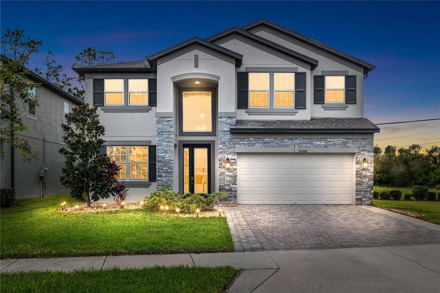 One or more photo(s) has been virtually staged. Step into this like-new CORNER LOT craftsman masterpiece home, BUILT in 2022 by M/I Homes is nestled in the sought-after community of Ehrens Mill! Offering 5 bedrooms, 3 full baths, a spacious 3-car garage, and 3,316 sqft. of living space, this home blends elegance, functionality, and comfort. With LOW HOA fees and NO CDDs, it’s the perfect place to truly call home. The home sits on a CORNER LOT with no neighbors to your right side facing the house, for extra privacy. From the moment you enter the grand foyer with its soaring 20-foot ceilings, you’ll feel the warmth and sophistication of this thoughtfully designed residence. A flexible formal dining room (or office) sets the tone for versatility, while the gourmet kitchen impresses with MODERN QUARTZ waterfall countertops, marble subway backsplash, stainless steel appliances, and a built-in coffee/wine bar. The OPEN-FLOOR PLAN layout features porcelain wood-look tile throughout, complemented by custom LED light fixtures, accent walls, tray ceilings, arched hallways, and a paid-off water softener. A guest bedroom and full bath on the first floor for convenience, while upstairs you’ll find four additional bedrooms, a huge bonus loft perfect for family gatherings or your own private movie lounge, and a luxurious owner’s suite with French doors, tray ceiling, spa-like bathroom, double vanities, quartz counters, garden jacuzzi tub, and oversized walk-in shower. Ideally located near top-rated schools, shopping, dining, and just 30 minutes to Downtown Tampa and 35 minutes to the airport, this home offers both a premier lifestyle and a sound investment. Schedule your private tour today—this one won’t last!