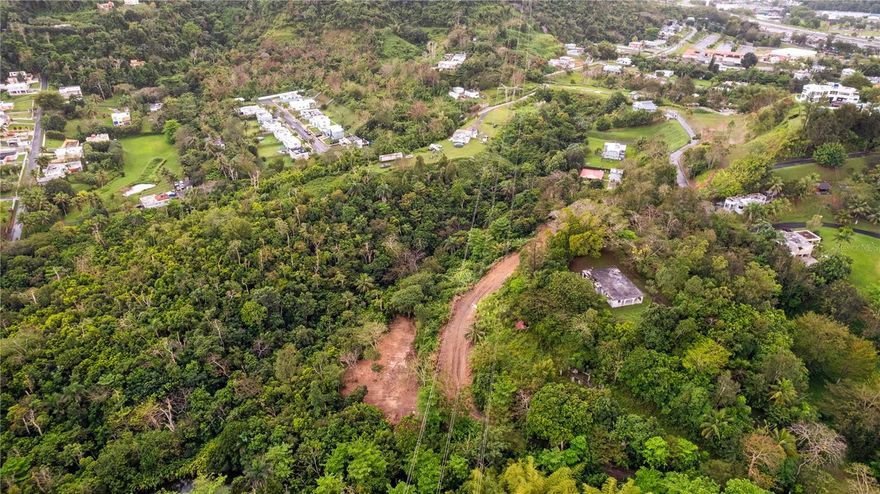 Rare 7.8-acre opportunity in Río Cañas Ward, Caguas. This expansive parcel offers a unique blend of natural beauty and functionality, featuring internal access paths, a natural water spring, and an existing gazebo structure with bathroom. The property is equipped with water and electrical connections, making it well-suited for a variety of uses.

Surrounded by lush greenery and offering privacy, this land presents an excellent opportunity for a private estate, agricultural use, or future development. Conveniently located at PR-796 Km 1.4, providing accessibility while maintaining a serene setting.