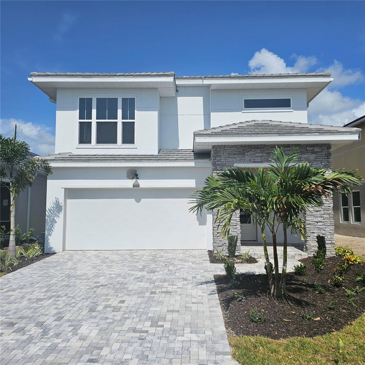 Under Construction. Experience the perfect blend of comfort, style, and low-maintenance living in the Redwing—a thoughtfully designed 4-bedroom, 3.5-bath home located in the highly desirable Vistera of Venice community. Nestled on a serene preserve lot, this under-construction home offers privacy and stunning natural views.
The open-concept layout features soaring ceilings and abundant windows that fill the home with natural light. The primary suite is conveniently located on the main floor for ultimate ease, while upstairs you'll find a spacious flex room—ideal for a home office, gym, or media space—along with a private on-suite bedroom perfect for guests or multigenerational living.
Built with peace of mind in mind, this home includes hurricane impact windows throughout for enhanced security and energy efficiency. Lawn maintenance is included, allowing you to enjoy more free time and less upkeep.
Vistera of Venice offers resort-style amenities to elevate your lifestyle, including a luxurious pool, state-of-the-art fitness center, game room, community bike share program, and an on-site activities director who curates events and programs for all ages.
Don't miss your chance to be part of this vibrant, active community—where comfort meets convenience in the heart of Venice. **Purchase a select David Weekley Quick Move-in Home in the Tampa, Manatee and Sarasota area from July 1-31, 2025, qualified buyers may be eligible for mortgage financing at a 4.99% interest rate (5.036% APR for conventional loans, 5.733% APR for FHA and VA loans) mortgage loan. Homes must close by September 1, 2025.