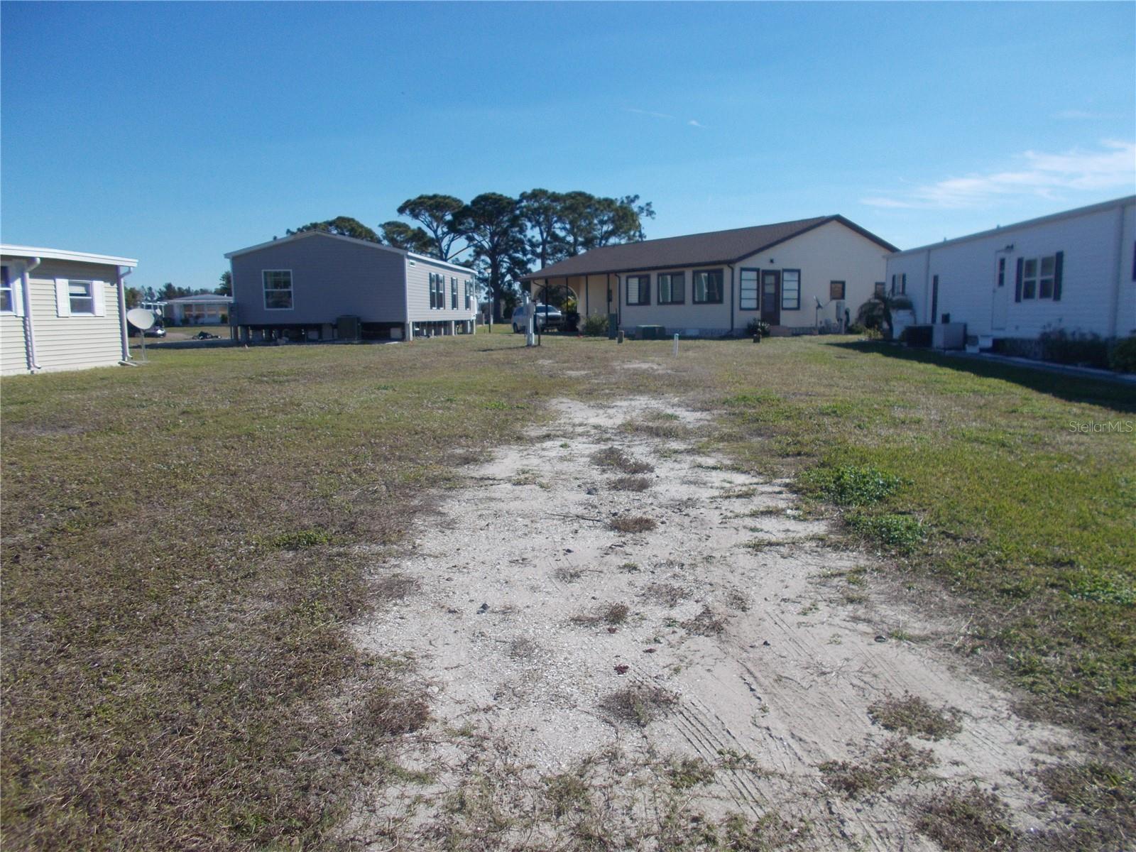 Vacant land in sought after 55+ Gated Community of Holiday Park and in the Pet Section. The land is located on Anapa Court which is a cul-de-sac. This lot is 4225 square feet. In Holiday Park you own the land with a deed and the maintenance fee of $2340.00 a year ($195.00 a month) is included in your taxes. Holiday Park offers many amenities including 2 Pools, Tennis Courts, Pickleball, Bocci, Shuffleboard, Laundry, Library, Horseshoes, Bingo, plus other card games, Fitness Room, and so much more. This home has been pulled off and the electric and water are in place. This is a perfect place for your new manufactured home. Come and see!