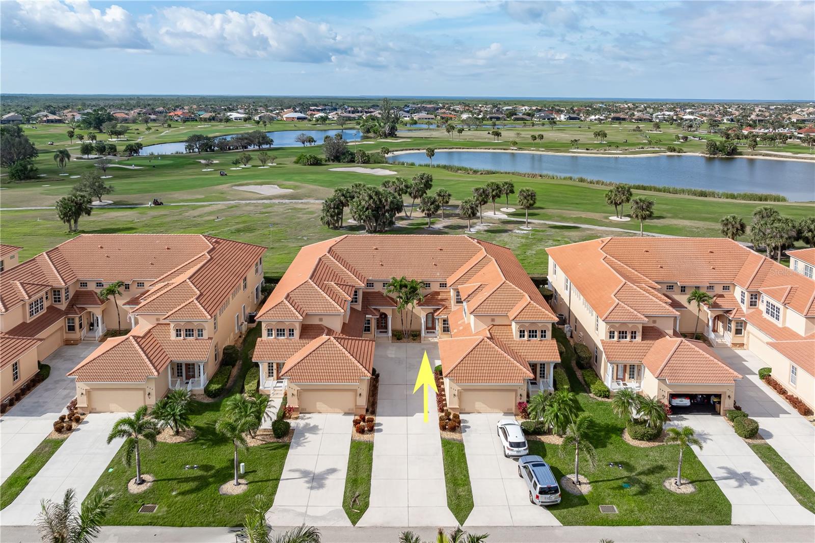 **SPACIOUS VIZCAYA CONDO W/PRIVATE 2-CAR GARAGE & GOLF COURSE VIEW** ALL CONDO BUILDINGS HAVE NEW ROOFS IN 2025! Enjoy relaxed living in this beautifully maintained 3 bed/2 bath condo with an attached 2-car garage & nearly 1,900 sq ft of living space, located in Vizcaya at Burnt Store Isles. Situated along the 8th fairway of Twin Isles Golf Course, this first-floor residence offers panoramic views of the greenway and adjacent lake. Inside, the open floor plan features a welcoming great room, defined formal dining area, and a gourmet kitchen designed with entertaining in mind. High ceilings with crown molding, luxury vinyl plank flooring throughout, and disappearing sliding glass doors offer seamless flow to the screened lanai. Vinyl sliders on the lanai allow year-round enjoyment, rain or shine. Sit back and take in the tranquil golf course views while watching golfers pass by throughout the day. The chef’s kitchen is equipped with raised-panel cabinetry, granite counters, stainless steel appliances, corner walk-in pantry, and a wraparound breakfast bar ideal for casual dining or conversation while cooking. The private master suite has direct access to the lanai and includes serene golf course views, a large walk-in closet, and a spacious en-suite bath with dual sinks, tiled walk-in shower, and private water closet. The split-bedroom layout ensures privacy for guests, with two additional well-sized bedrooms — one featuring a large, walk-in closet. Additional conveniences include an interior laundry room with room for full-sized washer/dryer, built-in cabinetry and mudroom-style access to the garage, which also offers a dedicated storage room. Storm protection is in place with electric roll-down shutters on the lanai and accordion shutters at the entry. Vizcaya is a well-run, pet-friendly association w/healthy reserves and all new roofs in 2025. Optional membership at Twin Isles Country Club provides access to championship golf, tennis, a heated pool, clubhouse dining, and a calendar full of social events. The location places you within walking distance to Burnt Store Marketplace, where Publix, Home Depot, several restaurants, and daily essentials are all just a short stroll away. This meticulously cared-for property offers a low-maintenance lifestyle with upscale comforts. Whether you're a seasonal visitor or a full-time resident, this condo delivers the perfect blend of convenience, space, and charm. Schedule your showing today!
