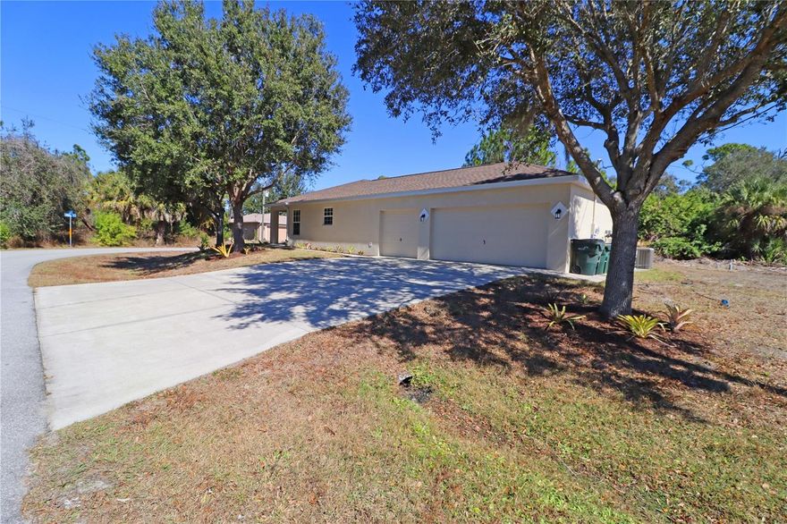 Remarkable  3 bedroom 2 bathroom 3 car garage on a corner lot in North Port. This home offers an open floorplan with a large kitchen including stainless steel appliances . A large liviving area along with a large primary bedroom and bathroom with dual walk-in closets and double-sink vanities. All freshly painted and brand new carpet , ready to move in now!