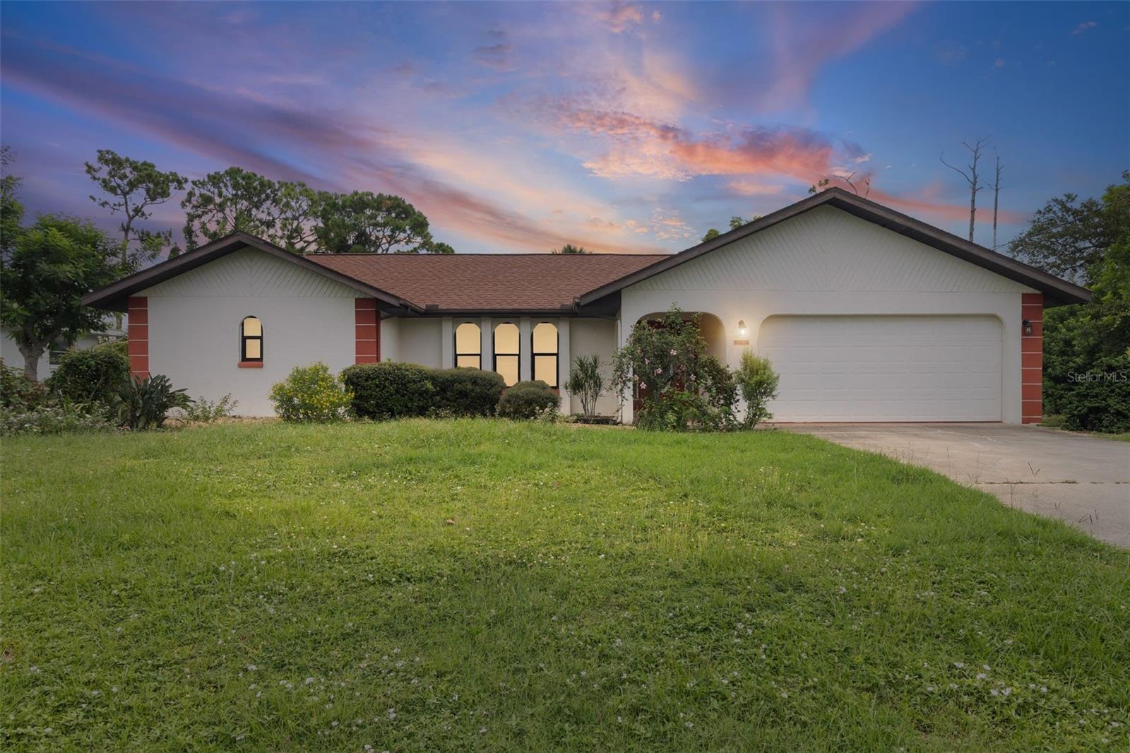 Waterfront Pool home on quiet Pellam Blvd. There is room for everyone with 3 Bedrooms, 2 Bathroom, 2 Living spaces, and 2 dining spaces. Primary bedroom and 2nd bedroom have private slider doors to the pool. Kitchen is spacious and open to you main living room. Primary bedroom has 2 walk-in closets and an ensuite with separate soaker tub and shower. ROOF 2024 This canal front home IS NOT IN A FLOOD ZONE. The lot is 1/3 of an acre and offers several fruit trees and a fishing dock. Pool is oversized and was recently refinished. NO HOA Don't miss your opportunity to own this piece of waterfront Florida paradise.