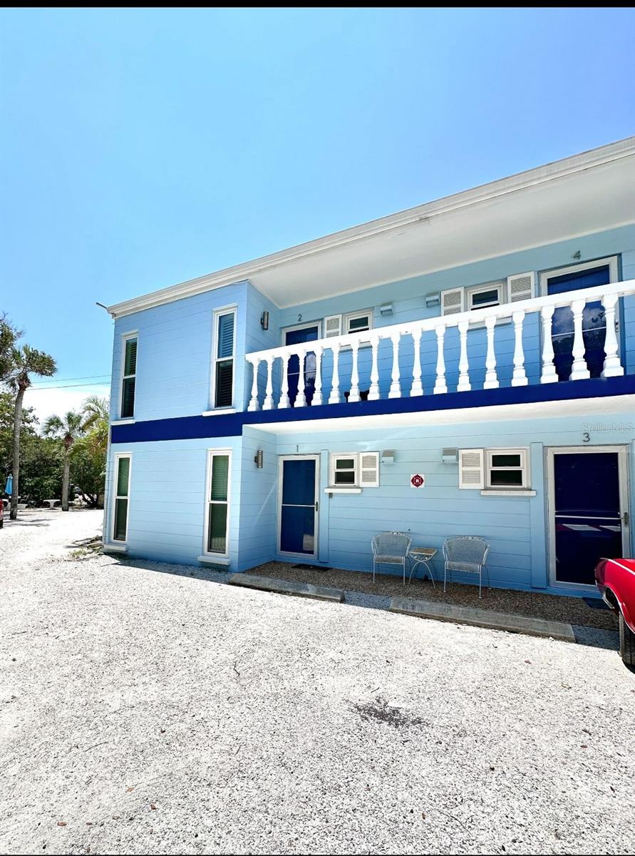 This beautiful corner unit is in excellent condition and has not experienced any storm damage, offering peace of mind for potential buyers. Additionally, being a two-story complex, association will not incur unexpected costs from new Milestone inspections providing buyers with one of the lowest quarterly fees on the island. Located just across the street from the turquoise, uncrowded public beaches of Longboat Key. You will enjoy captivating sunsets and partial Gulf of Mexico views in this lovely west facing 2 bedroom, 1 bath, upper level Longboat Key condominium. Conveniently located on the central portion of the key near the community park and tennis courts, Publix, library, CVS and various restaurants and amenities. Impact glass sliders and windows installed 12/2020 and new roof installed 4/2021. Pets and tenants allowed, see community details for restrictions.
