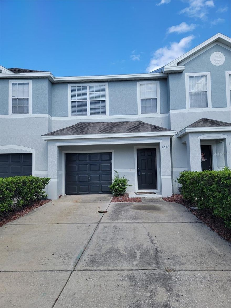 This builder upgraded 3-bedroom, 2.5-bathroom unit includes an attached one-car garage, a covered screened rear patio with pond view, and brand new Luxury Vinyl plank flooring. A built-in wine rack, water softener, newer garage door opener, water heater, fridge, and AC are all included. The first floor is composed of a spacious kitchen with all stainless steel appliances, a built-in pantry, and a half bathroom. The open floor plan connects the living and dining areas  and direct access to the back screened in patio with a view of the pond. Upstairs, you’ll find three spacious bedrooms, two full bathrooms, and a convenient laundry room. The primary suite stands out with its walk-in closet and private en-suite bathroom, while two additional bedrooms provide versatile space for family, guests, or a home office. This home also comes with a full set of metal storm shutters for added protection. The roofs in the entire complex were recently replaced, and the entire complex was also recently repainted. The community amenities include green spaces, a clubhouse, a dog park, and a community pool.