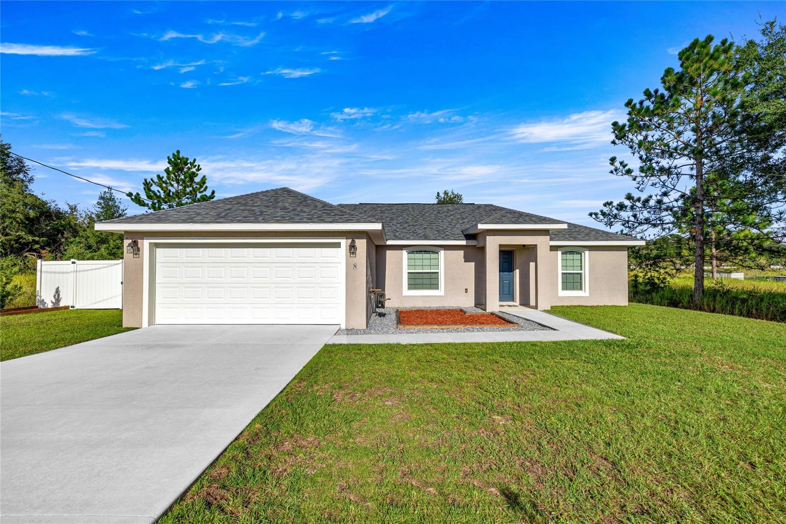 Welcome to this amazing and immaculate almost-new home, built in 2021! This beautiful 3-bedroom, 2-bathroom residence offers a bright and open split floor plan with high vaulted ceilings that create a spacious and inviting atmosphere. The kitchen features stainless steel appliances, beautiful countertops with a breakfast bar, and plenty of cabinet space. The master bedroom is generously sized, complete with a walk-in closet and granite countertops in the ensuite bathroom featuring a tiled shower. Enjoy outdoor living in the enclosed lanai that opens to a large, fully fenced backyard with white vinyl fencing and a storage shed for added convenience. With no HOA, this home is ideally located close to shopping, restaurants, and downtown Ocala. Don't miss out and schedule your private tour today!