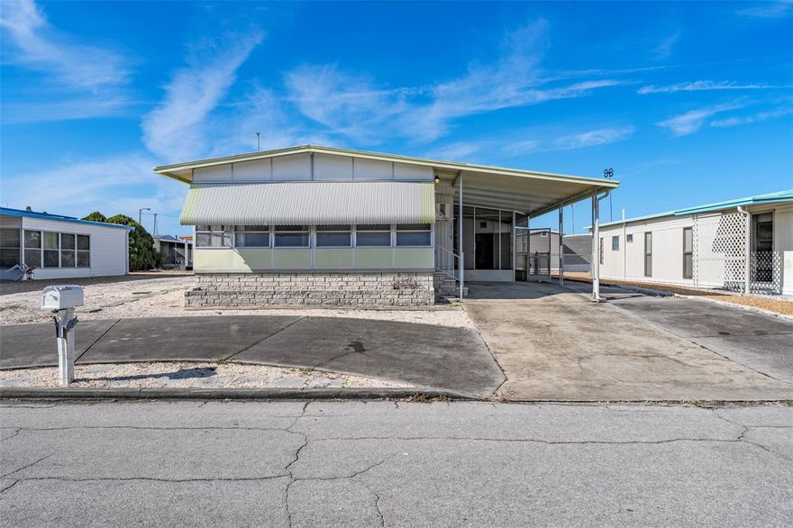 Affordable living in the deed-restricted Ponderosa Park, a 55+ community known for its active social calendar and low annual dues.

This 2-bedroom, 2-bath manufactured home offers a practical layout well suited for everyday living. The home includes a large enclosed sunroom with a built-in wall A/C unit, providing flexible space that can be used as a sitting area, hobby room, or additional living area.

Outside, there is a fenced area suitable for a small furry companion, along with covered parking and a circular drive for added convenience.

A key highlight of this home is the active 55+ lifestyle offered within Ponderosa Park. With annual HOA dues of just $250, residents enjoy access to a community pool, recreation center, and maintained common areas. For those seeking connection, the community hosts a full calendar of social events and activities, including fish fries, pancake breakfasts, ice cream socials, holiday dinners, and live entertainment. Resident volunteers play an important role in supporting these activities, creating a welcoming and engaged community environment.

Conveniently located less than one mile east of US-19 in Hudson, the community provides easy access to shopping, dining, medical facilities, and local amenities.

An excellent opportunity to enjoy low-cost living in a socially active 55+ community.