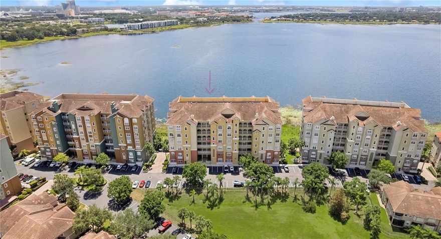 Welcome home!! Do not miss this opportunity. This stunning condominium with breathtaking LAKE VIEWS from the 4th floor boasts a spacious and comfortable space, perfect for entertaining guests or relaxing with family. As you enter the unit, you are greeted by a grand foyer that leads to the main living and dinning area facing BIG SAND LAKE. The adjoining dining area is ideal for hosting dinner meals with loved ones. The KITCHEN has been RENOVATED offering a NEW backsplash, and NEW cabinets. It is equipped with a speechless lake view and granite countertops. The master suite is a true oasis, offering a spacious bedroom with windows that offers tranquil lake views, NEW carpet, balcony access, 2 walk-in closet, and an en suite bathroom. The bathroom features dual vanities, a soaking tub, and a separate glass-enclosed shower. This unit also features 3 additional bedrooms, each with their OWN lake view to Little Sand Lake, closet space, 2 FULL bathrooms, a laundry room, 1 car garage in addition to the guests parking lots, and plenty of storage space. The unit has been FULLY REPAINTED as well with a light grey color throughout to match the kitchen and carpet colors. Enjoy breathtaking sunsets and serene lake views from the private balcony. The 24/7 gated community amenities include swimming pool, water, 24-hour security service, and tennis court. Conveniently located in the HEART of Dr. Phillips. Close to shopping, top rated schools, dining, and entertainment options such as Disney, Universal, convention center, among others. New AC. ROOF was just upgraded and the assessment was paid in full! This is a rare opportunity to own a beautiful renovated condominium with stunning lake views. *more than one virtual staged picture applies.