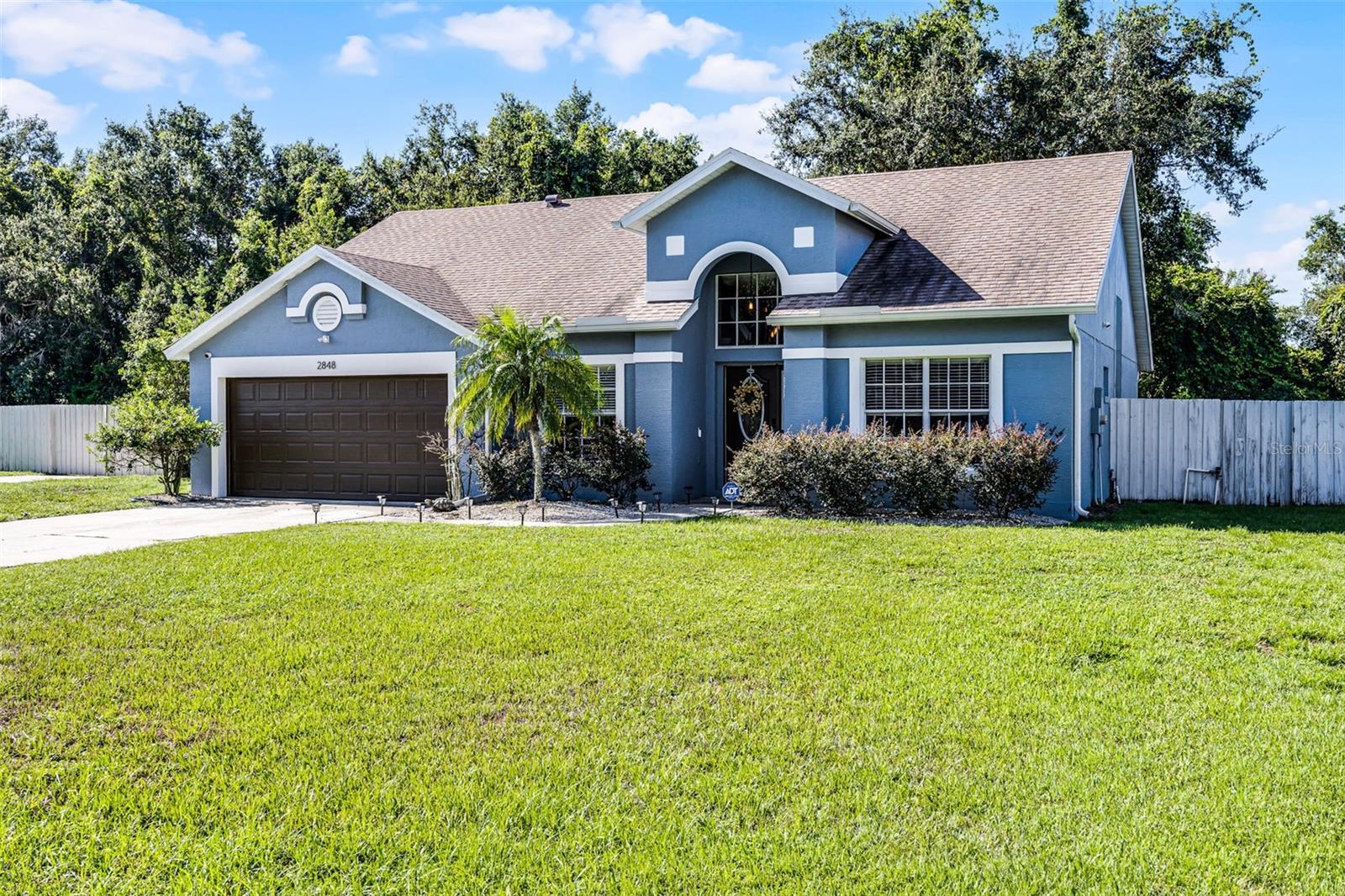 Live, Work & Relax in style in this beautifully updated home in Crooked Lake Ridge.
Don’t miss your chance to own this beautifully maintained and recently updated home in the desirable community of Crooked Lake Ridge. Set on an oversized 0.37-acre lot, this 3-bedroom + office, 2-bath home offers comfort, function, and the Florida lifestyle you've been searching for.
Step inside to discover fresh 2024 interior and exterior paint, new knock-down ceilings (no popcorn!), new blinds throughout (2023), and plank flooring for easy maintenance. Entertain effortlessly in the bright and airy open-concept living area with vaulted ceilings and charming built-ins that create a cozy reading nook or mini library.
The updated kitchen is a dream, featuring granite countertops, stainless steel appliances, 42” upper cabinets, soft-close cabinets and drawers, a pantry, breakfast bar, undermount sink, and built-in microwave. The spacious primary suite includes a refreshed 2024 en suite bathroom with an oversized walk-in shower with dual rain shower heads and a generous walk-in closet. Two additional bedrooms share a well-appointed full bath, and a separate home office provides privacy for remote work or a possible 4th bedroom.
Practical upgrades include a 2024 HVAC system, indoor laundry room with upgraded soft-close cabinets, and a brand new garage door.
Enjoy year-round Florida living on your screened rear patio, or in the fully fenced backyard, with room to roam, relax, or store your toys. A double-wide gate opens to an additional drive space, perfect for boat or trailer parking, plus there's a second front driveway for extra convenience. Peace of mind comes standard with a security system including cameras.
All of this, located minutes from schools, grocery stores, and premium healthcare, with easy access to the 429 and 414 for a smooth commute to Orlando, Sanford, Winter Garden, and major attractions. Nature lovers will appreciate nearby spring-fed lakes, Wekiva Trail, and top-rated fishing spots.
Spend your weekends exploring the charm of historic downtown Mount Dora—named to Southern Living Magazine’s “Best Small Towns in the South 2023” and USA Today’s “Best Small Town Food Scene” or head to downtown Eustis for First Fridays, live music, alfresco dining, and year-round festivals.
This is the Florida lifestyle you’ve been dreaming of. Updated, move-in ready, and filled with thoughtful upgrades. Schedule your private showing today!