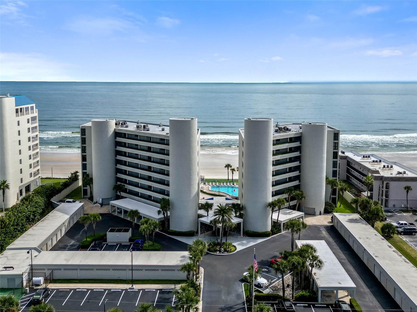 Penthouse Views of New Smyrna Beach's coveted No-Drive Beach and the Atlantic Ocean. This gorgeous top floor perch has been thoughtfully renovated and beautifully furnished. Residence 806 offers a "turn key" opportunity to join the Ebb Tide community. Residence 806 offers Panoramic views from the Great Room, Kitchen, Primary Suite and Expansive Balcony spaces. The great room features built-in cabinetry, wet bar and generous spaces for living and dining. The Kitchen features granite counter tops, glass cook top, french door refrigerator with bottom freezer and an additional "flex" drawer. A huge ocean front primary suite opens to the balcony and offers plenty of room for a home office space. The primary suite also includes double sinks, private water closet, walk-in closet and a large walk in shower. Both the Primary and 2nd bedrooms feature King Size Beds and built-in features for maximum storage. A generous laundry room provides additional storage for all the things that should be kept handy yet out of sight. Beautiful, neutral tile floors throughout all living areas. Accordion Storm Shutters provide lock and leave security. Residence 806 enjoys its own carport adjacent to the N. Tower for keeping your vehicle and you out of the weather. Ebb Tide offers a resort-style ocean front pool area with immediate and private beach access. Additionally, Ebb Tide residents enjoy a community Pickle Ball Court and complete Fitness Center. Beautifully maintained, Ebb Tide is one of the Jewels of New Smyrna Beach. This beautiful beach home is offered furnished. All measurements are approximate and Buyer is responsible for verifying dimensions. Be sure to check out the Photos and Virtual Tour to fully appreciate this tremendous value and opportunity.