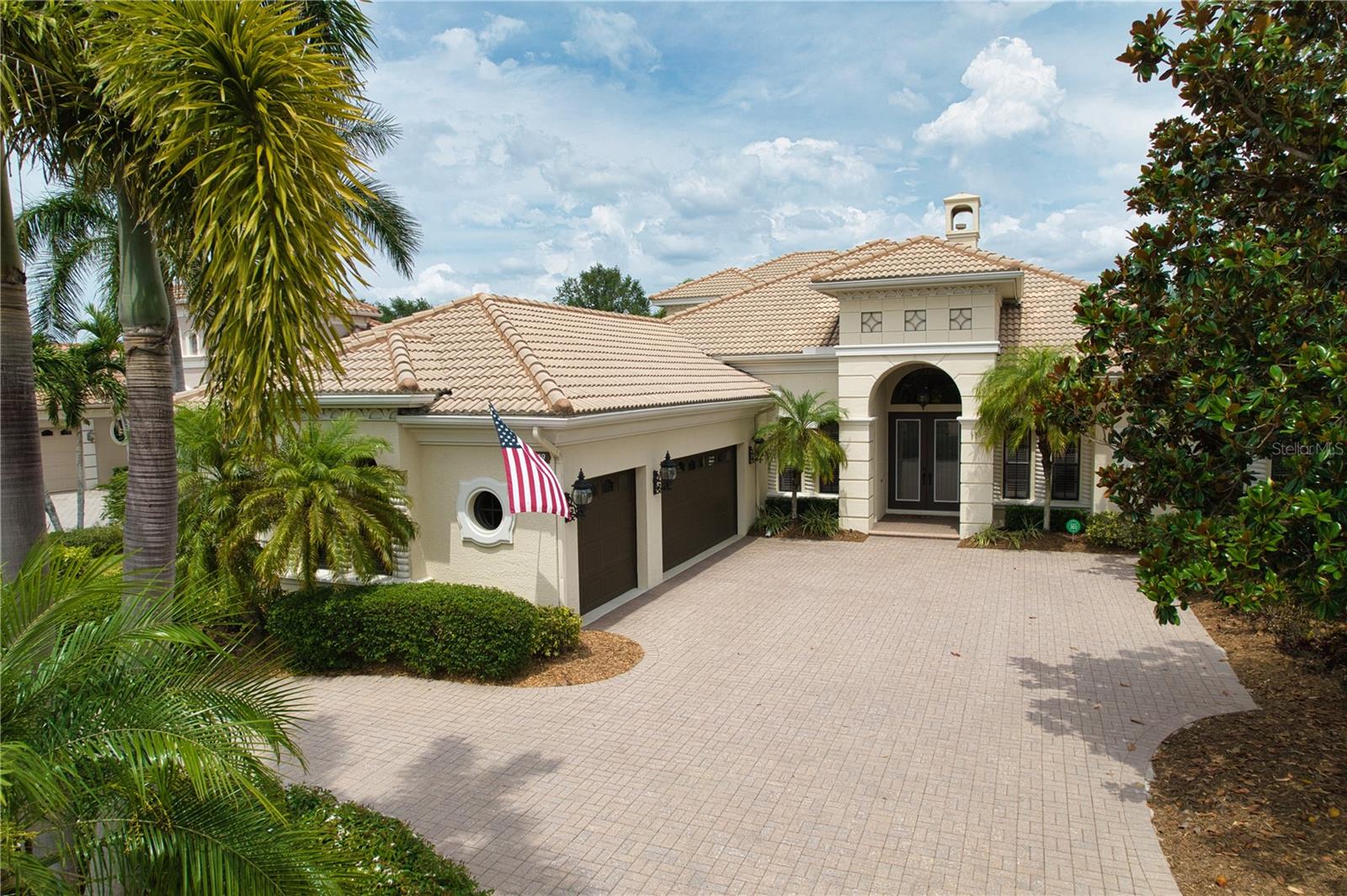 Welcome to "The Dominion" of Lakewood Ranch Country Club.
The Dominion is one of the most exclusive and desirable neighborhoods behind the gates of Lakewood Ranch Country Club. This custom Arthur Rutenberg masterpiece – The St. Vincent II model – offers the best in Florida luxury living. Perfectly situated on a premier homesite with breathtaking views of the golf course and glistening lakes, this "like new" 5 bedroom, 4 full bath, 2 office, is move in ready and even has a spacious upstairs bonus room, private guest suite, and covered balcony that overlooks the golf course and pool. This home provides the ideal blend of space, elegance, and function. The thoughtfully designed floor plan includes a newly updated chef’s kitchen with solid Wood Cabinetry & built-in pantry, Quartz counters, high-end appliances, and an open layout with beautiful outdoor views that flow through the Gathering Room—allowing for perfect entertaining and everyday living.
Architectural details abound: the stately exterior beckons you inside to take in the intricate crown molding, high tray ceilings and built-in features. The executive office located in the front of the home is spacious with built-in work space, cabinetry and is full of natural light. The secondary office/flex room (with full closet) is located at the rear of the home overlooking the golf course, and sliding glass doors open onto the pool deck. High decorative ceilings throughout create a sense of timeless sophistication. The primary suite is conveniently located on the main floor in its own private wing. With high ceilings, access to the pool and lanai area, this suite will accommodate large estate furnishing in style. Dual walk-in closets, and a luxurious and recently updated bath with a large walk-in shower, garden tub, and private water closet with bidet, round out the primary suite.
Step outside to your private saltwater pool and spa oasis, surrounded by lovely paving brick, and unwind under the covered lanai or in the cabana with a fully equipped modern summer kitchen—perfectly designed for year-round entertaining. The circular drive, side-entry garage, and dual 220V EV charging stations add modern convenience as well as curb appeal.
RECENT UPDATES: travertine-style porcelain tile, luxury vinyl plank flooring, new countertops throughout (except office), newer appliances including dishwasher, refrigerator, oven, cooktop, and dual-function microwave, front loading washer and dryer, All 3 AC units replaced with high-efficiency filter systems, and a 24KW natural gas Generac Whole House Generator will keep everything running during power outages, updated security system, recently refinished wood ceilings and freshly painted cabinetry (excluding office), along with an upgraded outdoor grill and hood.
Enjoy resort-style living with an optional membership to The Lakewood Ranch Country Club—offering 4 championship golf courses, 3 luxurious clubhouses, 18 Har-Tru tennis courts, pickleball, state-of-the-art fitness and aquatic centers, walking trails, and many social events. With no waitlist and optional membership, the choice is yours.
Situated near high-rated schools, premier medical facilities, parks, shopping, dining, and just minutes to Gulf Coast beaches, this property represents not just a house but a lifestyle of luxury.
Live the dream—schedule your private showing today!
**THIS PROPERTY QUALIFIES FOR A 1% LENDER INCENTIVE IF USING PREFERRED LENDER. INQUIRE FOR MORE DETAILS.**
