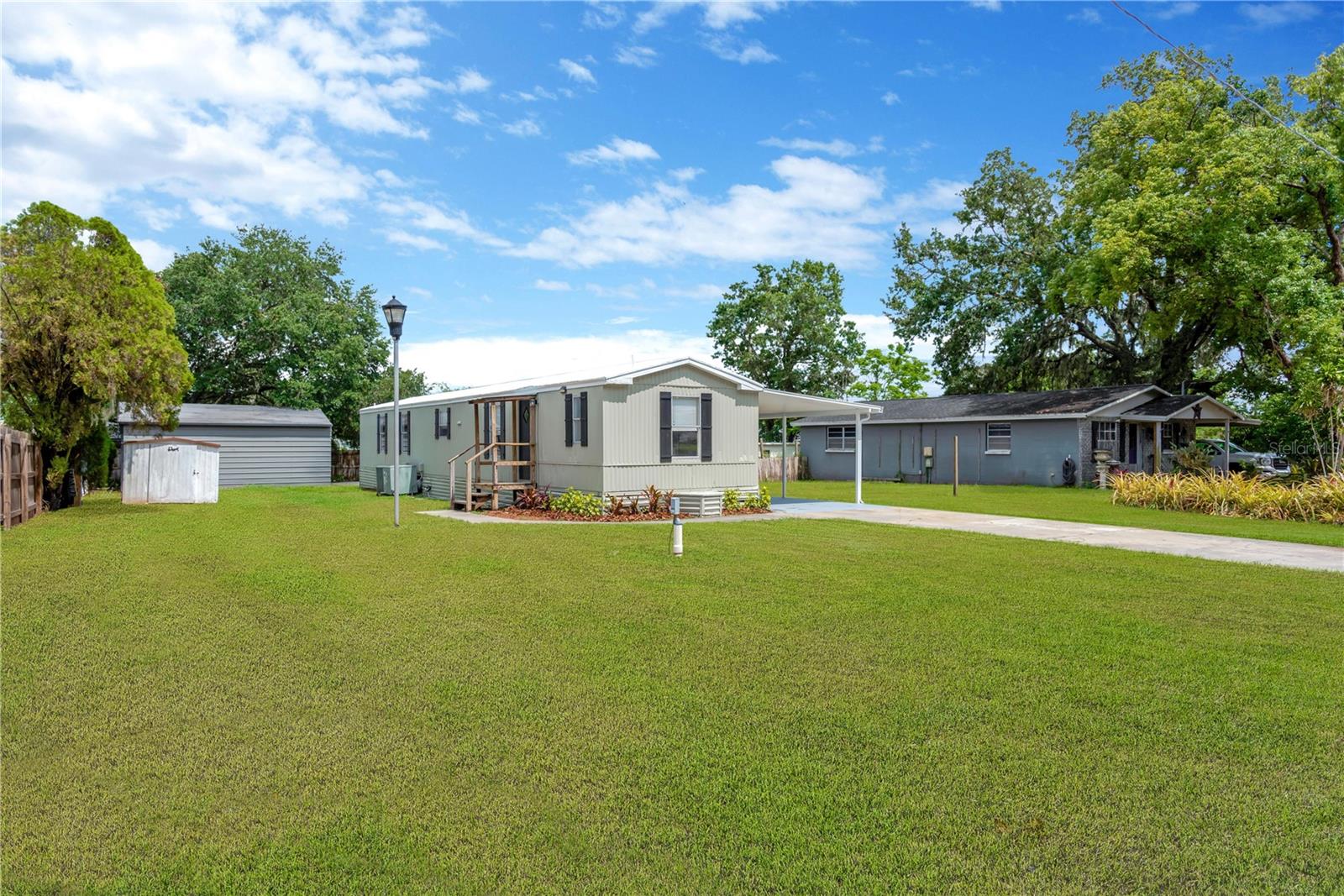 Best deal in town! Located in the heart of desirable Valrico, this home offers Florida living in style… on a quiet street with NO HOA and NO FLOOD ZONE! Homes this well-maintained and tastefully designed rarely come available in this area and this home is loaded with extras! Other Valrico homes in this price range are in a flood zone or need a ton of work. But this one is beautiful and move-in ready! The kitchen features beautiful cabinets, bright countertops with TONS of prep space, and STAINLESS STEEL appliances. You will enjoy an open entertaining area with spacious living room, which features beautiful waterproof luxury plank flooring and tons of natural light. A large living space is perfect for making memories and enjoying time with family and friends. The large master suite features a private en-suite master bathroom, and tons of closet space. A lovely dinette space off the kitchen could is the perfect space for quick meals and relaxing dining events alike. A fantastic floor plan offers everyone plenty of privacy and space to spread out. Two additional bedrooms feature ample closet space. The guest bathroom is sparkling fresh, and offers a calm sense of elegance. Outside you’ll enjoy the Florida lifestyle while entertaining family and friends in your large yard.An indoor laundry offers the ultimate in convenience and comfort. NO HOA means you have the freedom to make this home yours, and you’ll have plenty of space for your toys, boat, trailer, or more. A full CARPORT and detached POLE BARN mean you have plenty of space for everything you could dream of. Close to restaurants and shops, and all the convenience of town, your new home is exactly where you want to be. Everything’s been done for you, so all you need to do is schedule your showing today and make this one yours!