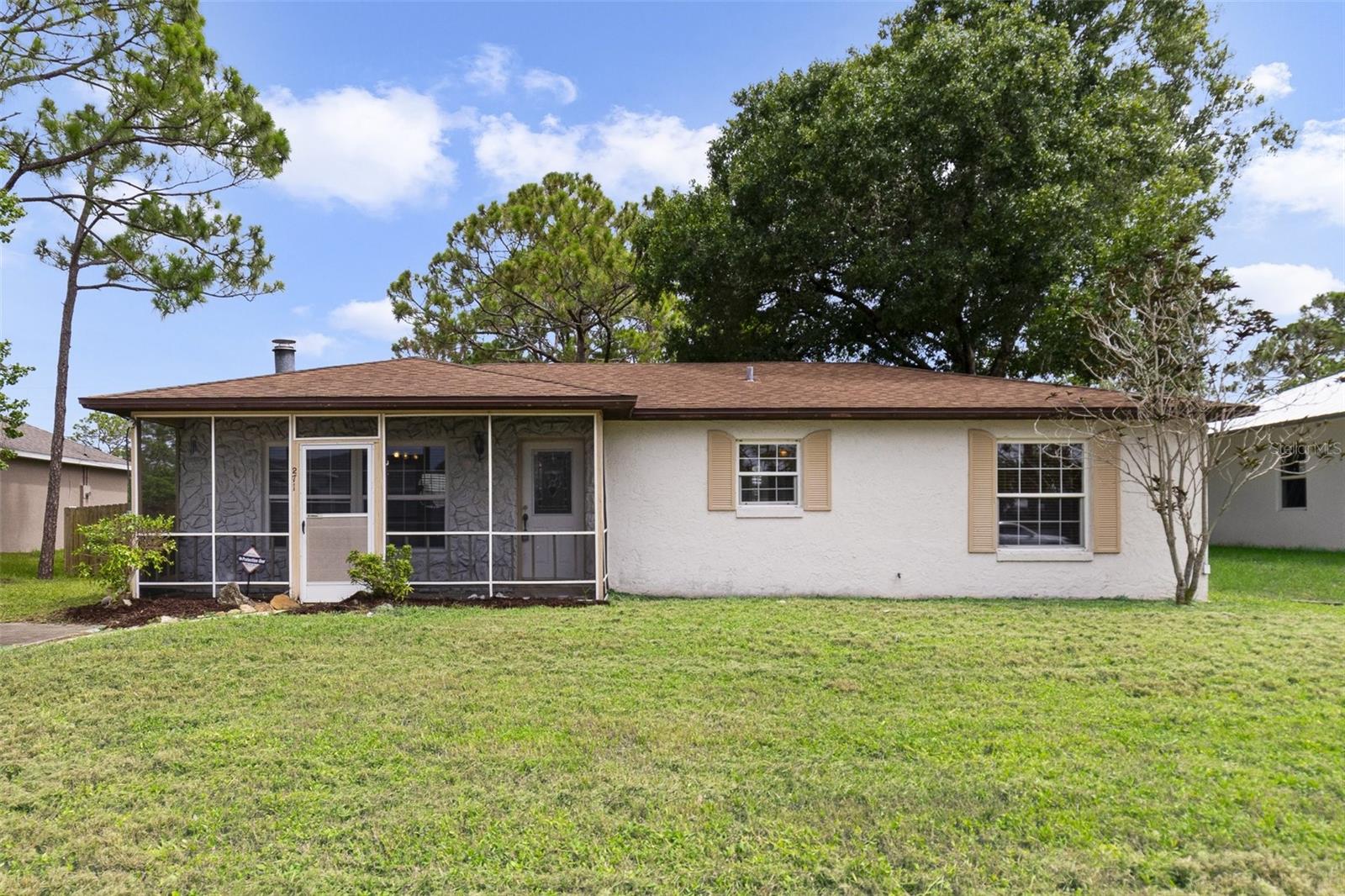 This property QUALIFIES FOR A CREDIT UP TO $3450 through the seller's preferred lender ***Welcome to your next opportunity in the heart of Palm Bay’s popular Port Malabar community! This single-story 3BD/2BA home sits on a spacious .23 ACRE LOT and offers a functional layout with room to grow, personalize, or invest. Step inside to a bright, OPEN LIVING SPACE where the living room, dining area, and kitchen flow seamlessly—perfect for everyday living or entertaining. A cozy FIREPLACE anchors the space, while large windows invite in beautiful NATURAL LIGHT throughout. Ceiling fans in every room help keep things cool and comfortable year-round. Enjoy Florida mornings on the SCREENED FRONT PORCH, or head out back through French doors off the dining area to your private backyard—plenty of space to garden, play, or relax. The large laundry room offers additional storage and utility space for added convenience. The DETACHED GARAGE sits just steps from the home, ideal for vehicles, a workshop, or extra storage. With NO HOA, this property gives you flexibility whether you are looking for a starter home to update and make your own, or a smart investment property in a growing area. Located just minutes from I-95, this home offers quick access to shopping, restaurants, schools, and local attractions like the Palm Bay Aquatic Center. You are also just a short drive to the Indian River and the beaches beyond—coastal living made easy! Don't miss your chance to own a home in a well-established community with a great layout, tons of potential, and a prime location on your side. !! Bonus !! The seller is willing to offer CREDIT TOWARDS A NEW ROOF – call for details!