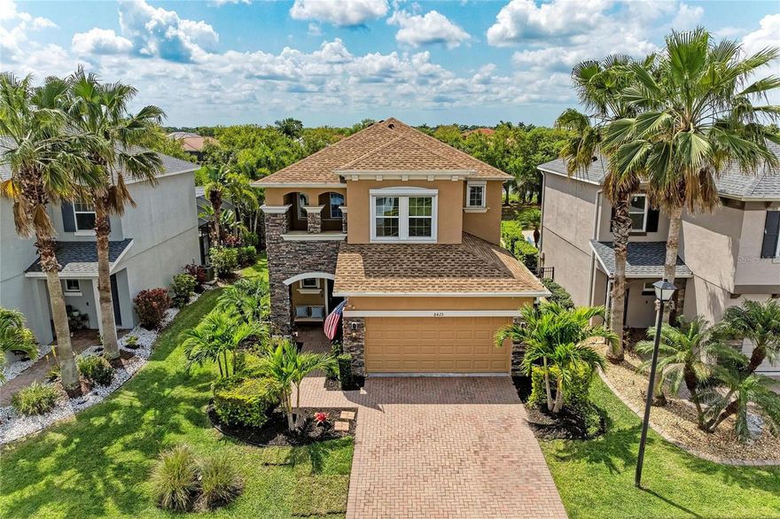 Welcome to Palmer Lake and this beautifully maintained 4-bedroom, 2.5 bath, two-story lakefront home offering 2,371 square feet of comfortable living space in a superb Sarasota location. Built in 2013 featuring a recently replaced roof along with the added security of roll-down storm shutters, providing move-in ready peace of mind. 
This residence blends modern convenience with peaceful waterfront views. Step inside the foyer and be captivated by the 25-ft ceiling entry leading to a spacious great room floor plan, perfect for both everyday living and entertaining. The open-concept design flows seamlessly into a generous kitchen area with abundant prep space, ideal for cooking and gathering. A convenient half bath is located just off the great room, along with a den and a practical storage room tucked underneath the stairs. Upstairs, you’ll find a large master suite retreat with ample space to unwind, along with three additional bedrooms to accommodate family, guests, or a home office. The front bedroom even has a murphy bed for added comfort and convenience.    
Enjoy Florida living at its best within the fenced backyard overlooking the lake, complete with covered patio – perfect for relaxing or hosting outdoor get-togethers. This home also features a paver driveway and walkway, adding to its curb appeal. Located in an A+ school district and just minutes from popular Rothenbach Park and the scenic trails of The Celery Fields. A superb Sarasota location and just a short drive to downtown Sarasota and its beautiful Gulf beaches. This home offers both convenience and lifestyle as lawn maintenance is included in the reasonable HOA fee, and there is NO CDD fee – making ownership even more appealing. The Palmer Lake community also offers a peaceful lakeside gazebo for its residents. For those hobby arborists, the back yard of this home even has a fruit-bearing lemon tree. 
This is a rare opportunity to own a move-in ready lakefront home in one of Sarasota’s most desirable areas.  Schedule your private showing today and envision the lifestyle that awaits.