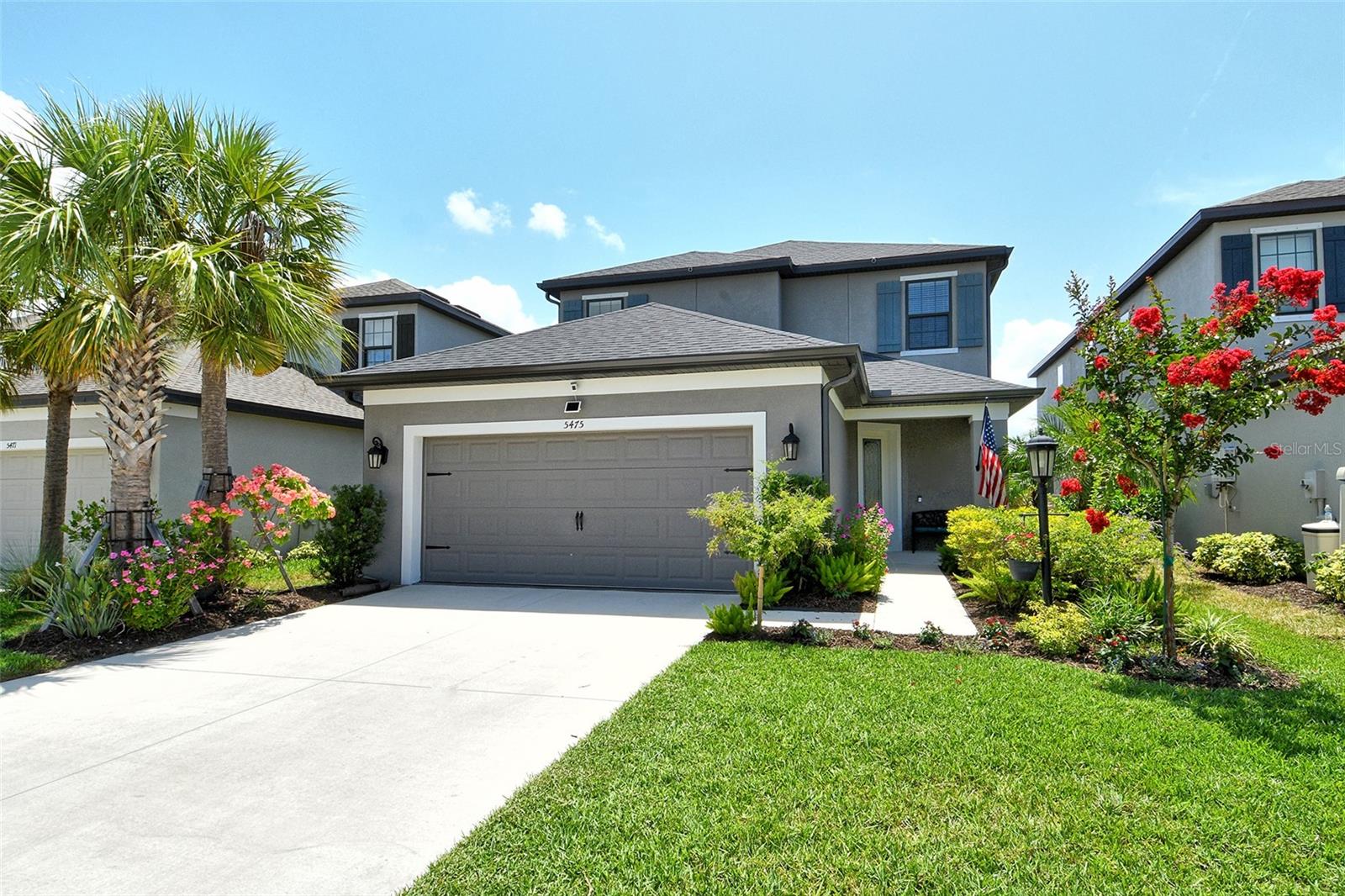 This is the one you've been waiting for! Welcome to 5475 Summit Glen — a perfect blend of luxury, comfort, and intentional design. This impressive 4-bedroom, 3.5-bath home boasts over 2,600 square feet of bright, beautifully curated living space. The open concept layout includes a FIRST-FLOOR PRIMARY SUITE with a spa-inspired ensuite bathroom, a private HOME OFFICE ideal for remote work, and a beautiful gas HEATED SALTWATER POOL with sun shelf for ultimate relaxation.
From the moment you arrive, the curb appeal is undeniable; a meticulously maintained yard features professionally designed landscaping that sets the tone for the elegance within. Welcoming you inside through a hurricane-impact glass entry door, you'll immediately notice a light-filled home complete with high-end upgrades and functional features.
Step into refined living with luxury vinyl plank flooring that extends throughout the kitchen, dining, and living areas. The gourmet kitchen is a true showstopper; white shaker cabinets, quartz countertops, under-cabinet lighting, soft-close drawers, and abundant storage.
Designed for both comfort and elegance, the open-concept dining area seamlessly connects to a grand living area with soaring ceilings and a stunning three-tier chandelier that serves as the centerpiece of the space. Entertain effortlessly with pocket sliding doors that lead to a spacious lanai and pool area, complete with a fully equipped OUTDOOR KITCHEN. Enjoy a spacious and fully fenced yard with a serene water view.
Retreat to the first-floor primary suite, offering privacy and comfort. The spa-like ensuite bath includes upgraded porcelain tile flooring, frameless walk-in shower, dual vanities, a private water closet, and a large walk-in closet.
Upstairs, discover a second bedroom and attached bathroom that includes a frameless walk-in shower—perfect for guests or multi-generational living. Down the hall, you'll find an additional full bathroom, two generously sized bedrooms, and a versatile loft ideal as a second living area, playroom, or game room.
Additional premium features include a whole-home Generac gas-powered GENERATOR, interlocking PVC garage flooring, HURRICANE-IMPACT windows on the second floor, RAIN GUTTERS, and a FULLY FENCED backyard.
Location is everything—and this home delivers. Tucked away within the gated community of Grandview at the Heights, you're just minutes from University Parkway and the endless shopping and dining options at UTC, world-class beaches, SRQ Airport, and downtown Sarasota. With low HOA fees and no CDD, this community is a hidden gem. Enjoy a pet park, tot lot, basketball court, and access to Mount Tumalo. The mountain contains two miles of walking trails, an additional pet park, exercise stations, and breathtaking views.
Aggressively priced and packed with upscale features, this 3-years young home isn’t just a place to live—it’s a lifestyle upgrade.
