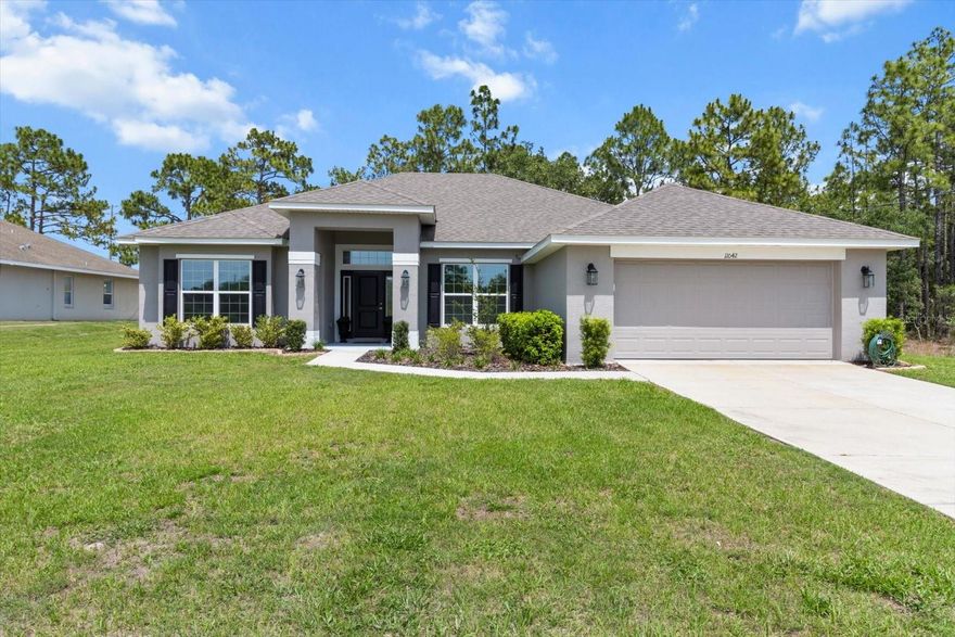 Welcome to this stunning, like-new construction home! Why wait to build when you can start enjoying your home today! Ideally located in the thriving Royal Highlands community of Hernando County. This spacious 4 Bedroom/2-bathroom residence, with a private den featuring French doors, offers the perfect blend of comfort, function, and style. Step inside to discover cathedral ceilings, an expansive open concept layout, and eat-in kitchen, perfect for entertaining. The kitchen is a chef's dream, featuring stainless steel appliances, 42-inch upper cabinets with crown molding and a large dining area that flows seamlessly into the family room. The guest bathroom includes direct outdoor access, ideal if you decide to add a future pool and features, a deep soaking tub and dual sinks. All guest bedrooms are generously sized with ample closet space and natural light. Additional highlights include in ground sprinklers, and a septic and well system for lower utility costs. The primary suite is a true retreat with tray ceilings, accented by crown molding dual walk-in closets, dual sinks, luxurious, soaking tub and step in shower, surrounded by floor to ceiling tile. Enjoy morning coffee or evening breezes on your covered patio under a stylish under ceiling lanai. Conveniently located just minutes from US Highway 19 and Cortez Boulevard, this home is minutes from Weeki Wachee State Park and Buccaneer Bay, and only 45 minutes to Tampa International Airport via the nearby Suncoast Parkway. You’ll also be close to shopping, dining, and the Tampa Premium Outlets. Don’t miss this exceptional opportunity! Schedule your private Showing today and make this beautiful home yours!