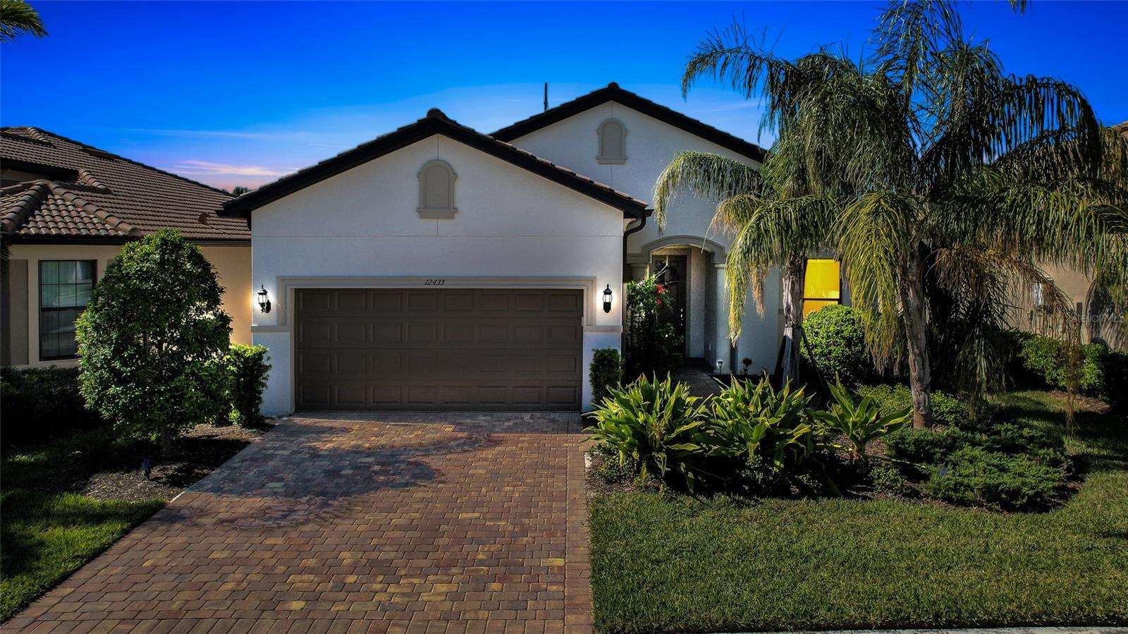 Finally! – this is the one you have been waiting to see! This 2022 Martin Ray 3 bedroom/2 full bath plus a versatile Flex Room and extended 2-car garage home is loaded with upgrades. Built with Impact Glass sliders & windows, this open floorplan with soaring 11’ ceilings and 8’ interior doors provides an abundance of natural light. Easy-care porcelain tile throughout and light-toned interior finishes set an ambiance for relaxation and coastal entertainment. The Chef’s Kitchen anchors the heart-of-the-home and features a gas range, 42-inch high, light solid-wood cabinetry and stainless upgraded appliances. Guests & family will gather around the oversized granite kitchen island with overflow into the adjacent dining area or relaxing Al Fresco on the extended screened Lanai for the western sunsets. A large breakfast bar, generous walk-in pantry & a flexible pass through service area can be set up for additional multiple uses. A luxurious primary suite with a spa-like ensuite bathroom features upgraded comfort-height cabinetry, granite countertops, dual sinks, a walk-in shower & an oversized walk-in closet. This thoughtful floorplan provides plenty of storage, a private location for bedrooms 2 & 3, a laundry room that is centrally located for easy access & an expanded 2-car garage to accommodate your Florida lifestyle equipment. A Maintenance-free Community, enjoy peace of mind behind the entrance gates & embrace the Resort-Style living offered by the clubhouse, Barefoot Bar, heated pool & spa, & fitness center. Pickleball, tennis, bocce courts, a fire pit, fishing pier & on-site Property Manager round out the exceptional amenities. Furry-family members are welcome here & will enjoy the 2-sided Dog Park for both large & small canines. All this with easy access to Downtown Sarasota’s Cultural Center, charming Downtown Venice, the world-famous beaches and the 20+ mile storied Legacy Trail. Don’t miss the opportunity to own this move-in ready piece of Paradise!