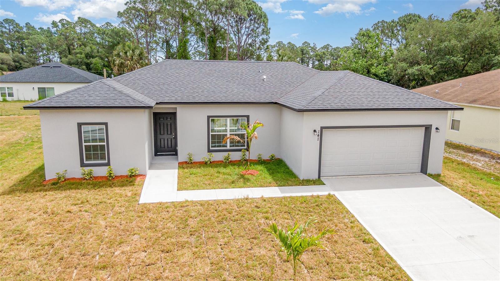 Brand New Construction READY NOW! 3 Bedroom, 2 Bath home located in Florida’s Space Coast. This model offers an open concept floor plan with a spacious living area, modern kitchen, and a dining space. Upgrades include granite countertops in both the kitchen and bathrooms, stainless steel appliances, and luxury vinyl plank flooring throughout for easy maintenance. The split-bedroom floor plan offers privacy to the primary suite which features a large walk-in closet, dual sink vanity, and a tiled shower. Located minutes from Jupiter Blvd, public transportation, K-12 schools, highway I-95 and less than 30 minutes away from Brevard Zoo, Indian River, and Melbourne Beach! SELLER OFFERING $5,000 TOWARDS BUYERS CLOSING COSTS OR RATE BUY DOWN!!