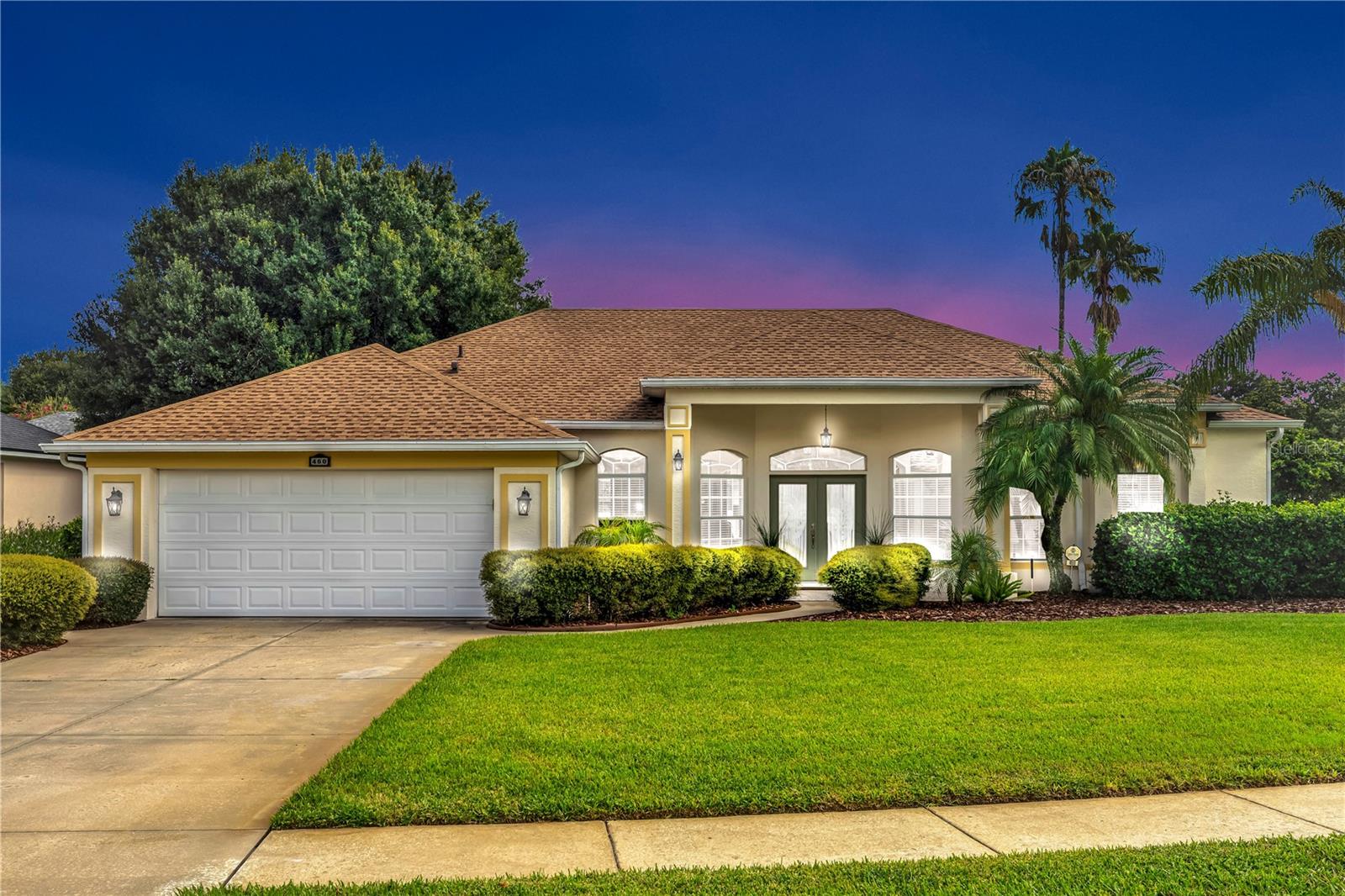 ABSOLUTELY IMMACULATE, move-in ready home on an oversized (.31 acres) corner lot with upgrades galore located in the highly desirable DeBary Golf & Country Club! Welcome to this stunning and beautifully maintained home where style, comfort, and function come together seamlessly. Located on a pristine corner lot with a well-manicured lawn and white vinyl fencing (installed April 2024), this home offers incredible curb appeal and modern upgrades throughout. Step inside to this 3 bedroom, PLUS office, 2 bath home featuring soaring tall ceilings, elegant crown molding, and abundant natural light. The real wood flooring in the main living area adds warmth and charm, while marble tile in the kitchen and bathrooms exudes luxury. The NEWLY renovated kitchen is a true showstopper, featuring white wood soft-close cabinets, granite countertops, deep sink, marble backsplash, new garbage disposal, and stainless steel appliances. Enjoy versatility with a formal dining room, breakfast nook, and a beautiful home office with French glass doors. The spacious primary suite offers private access to the backyard through sliding doors, a walk-in shower, garden tub, and double vanity. Additional highlights of the home include, newer HVAC (Feb 2023), newer roof (June 2023), newer water heater (May 2024), Washer & dryer included, spacious screened-in patio for year-round enjoyment, shelved laundry room with utility sink, attic access and side-entry 2-car garage, sliders that fully open for indoor-outdoor flow, irrigation system to keep the lawn lush. This meticulously upgraded home is truly move-in ready with everything done for you. Schedule your private tour today—you won't find another like it! This home may be under audio and visual surveillance.