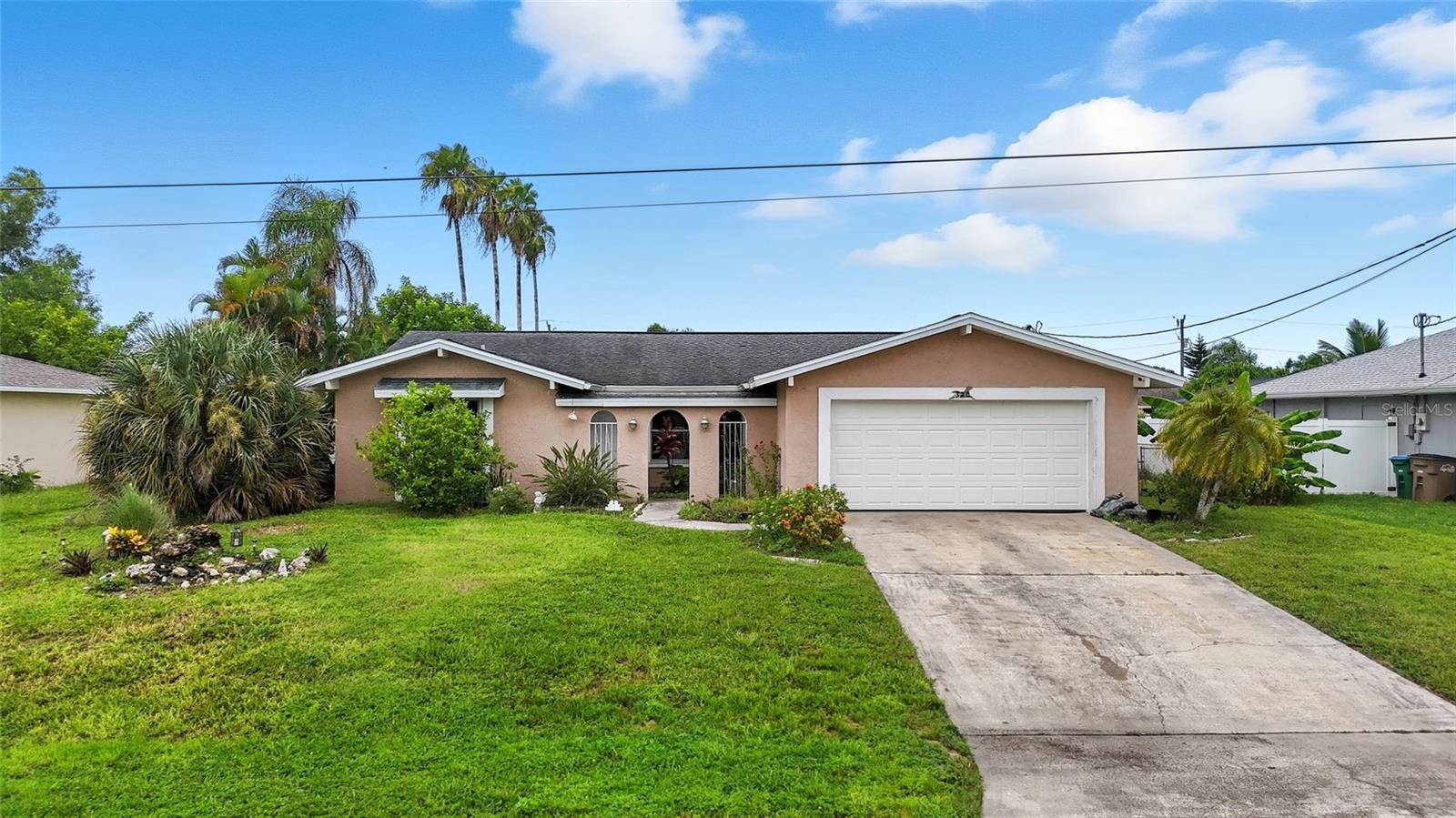 POOL HOUSE with 2 OWNER'S SUITES ON CITY WATER + SEWER, CENTRAL LOCATION, 1 MIN TO CAPE CORAL HOSPITAL. Spacious 4-bedroom, 3-bathroom pool home! This property is all about location and potential. With a little TLC you will have the house of your dreams! Inside, you’ll find an open layout filled with natural light, kitchen with stainless steel appliances, and plenty of cabinet space. Some of the upgrades include: hurricane impact garage door, impact windows, and a 7-yr old roof, brand new AC and new water heater for peace of mind. Create your beautiful oasis in the back yard (pool is in working condition) needs some maintenance, backyard is spacious and fully fenced with a variety of fruit trees for your enjoyment! No HOA fees and not in a flood zone! SELLER CONCESSIONS BEING OFFERED!