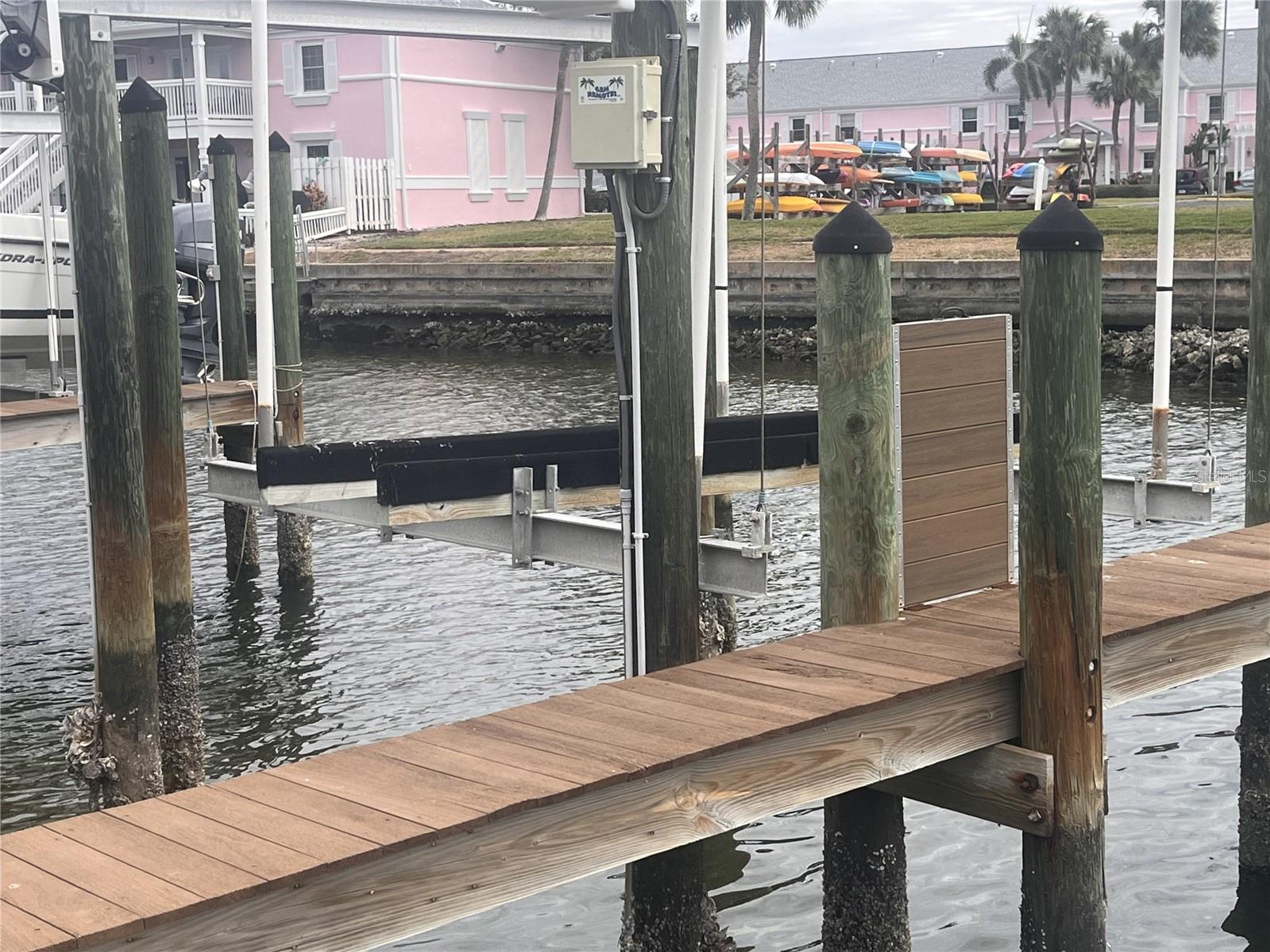 This boat slip is located within the resort style waterfront gated community of Waterside at Coquina Key South Village. The slip is located on Canal 4, behind building 32 and can accommodate up to a 30' vessel. There is a view of the Bay and Skyway Bridge from the dock. Open water access to Tampa Bay and the Gulf of Mexico, no fixed bridges. The slip has a 7,000 lb. capacity lift, a secure storage box and hooked up to water and electricity and is handicap ramp accessible. The Dock Association also provides for all future maintenance and repairs. The owner must be an owner of a condo in either Waterside North or South, but it can be leased to any resident within Waterside North or South.
