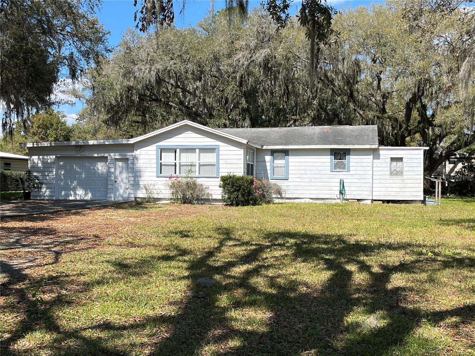Discover country living with convenience! This 2-bedroom, 1-bath home on 0.93 acres is centrally located near I-4, making commuting a breeze. Featuring an optional 3rd bedroom, a one-car garage, and a storage shed, this home offers plenty of space and versatility. Whether you're looking for a starter home, investment opportunity, or a rental property, there’s lots of potential here! Enjoy the expansive yard, perfect for outdoor activities, gardening, or future expansion. Don’t wait—schedule your showing today!!!