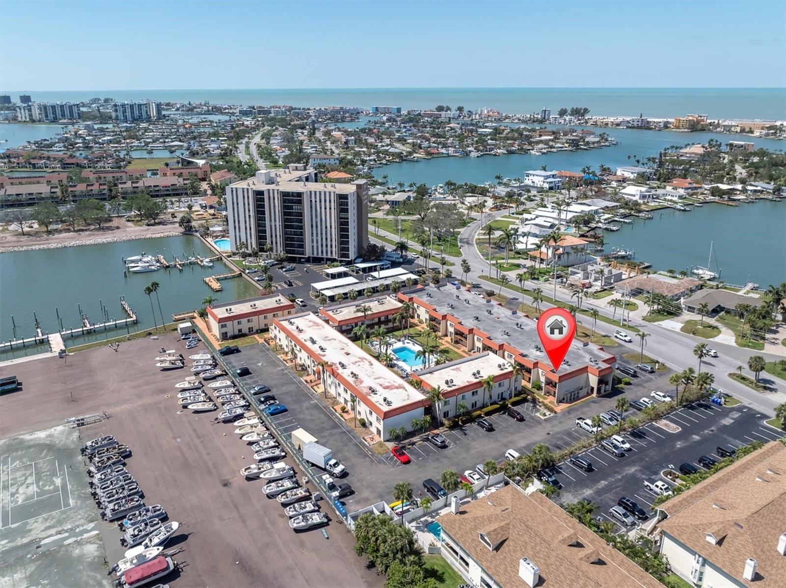 This unit is high and dry with NO STORM DAMAGE! Best price on the beach! Great waterfront 1 bedroom, 1 Bath condo in Treasure Island ready for you, your family, and your renters! Your unit is turn-key, move-in ready and fully FURNISHED! A short walk to the beach makes this the perfect setting for someone that plans to be a full time or part time resident. Investors is this for you, this is a 1-month minimum rental period, which means you can rent this out by the month or longer on the day you buy it. This is an end unit, so you have a stairway right outside your door, meaning this unit has tons of privacy. Treasure Island Villas is a well-managed community, and you will see that as you walk the grounds. On the grounds you can store your kayak or bike. There is a great bbq area near the water to enjoy for a cookout waterfront anytime you desire, the fishing pier provides enjoyment and possibly dinner or just relax enjoy the view, your small private beach and maybe read a book. It's a short walk to Treasure Island Beach, which is nestled between Madeira Beach to its north, and St. Pete Beach to its south, this is the "Old Florida Beach Life" that you've dreamed of. In just a short stroll you have sunsets at the beach, restaurants, entertainment and a ton of retail establishments! Close proximity to hospitals, clinics, airports, parks, etc. A nice slice of paradise, on Paradise Boulevard. Emotional Support Pets are allowed with proper paperwork and HOA approval. Come take a look at this great condo that you can call home, for a great price!