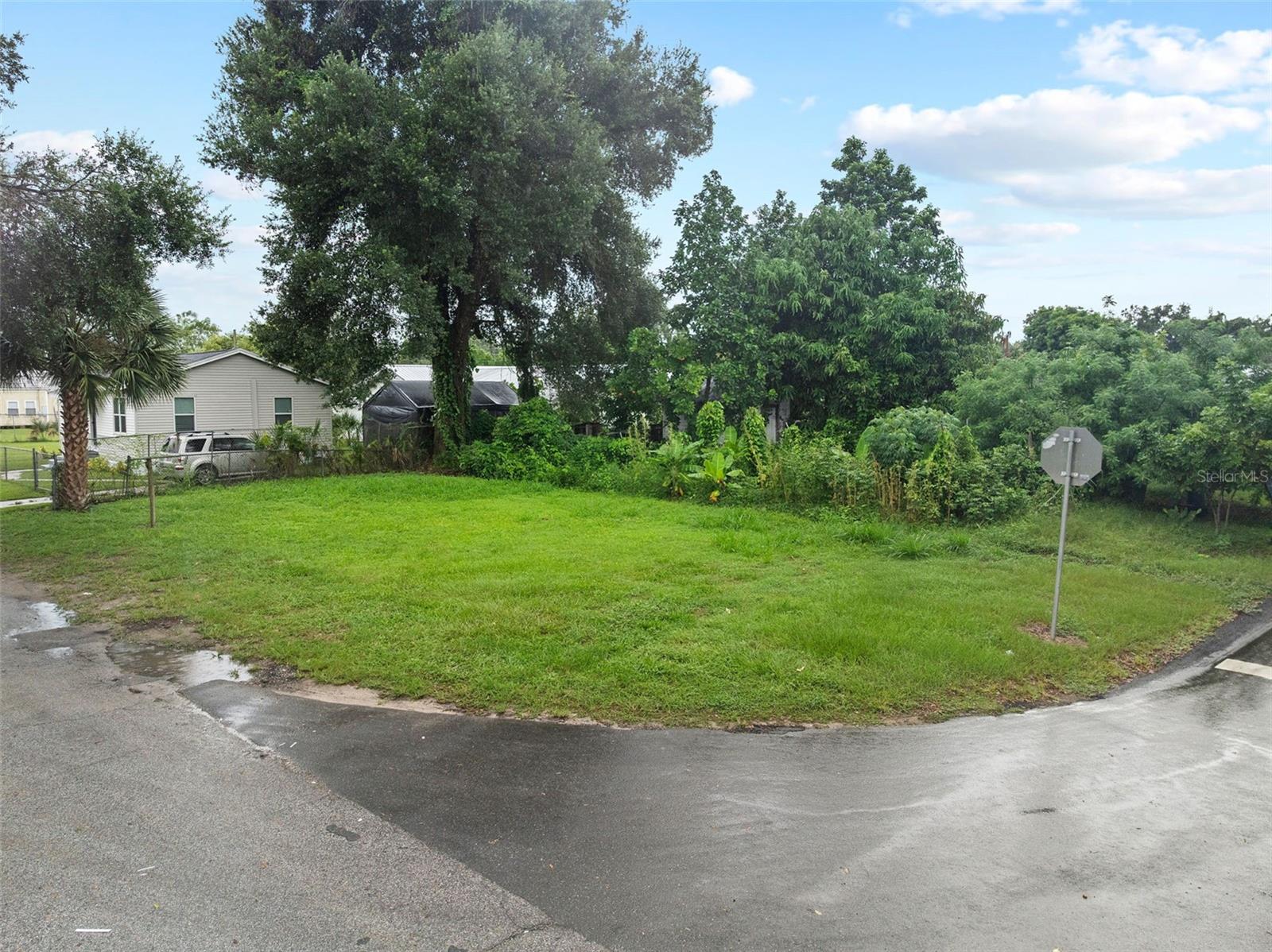 Cleared, level lot ready for construction in established Bartow neighborhood. Convenient location approximately 4 miles from Bartow Sports Complex and 2 miles from downtown commercial district. Property offers access to major employment centers - Between Orlando and Tampa via US-98 and State Road 60. Interstate 4 access approximately 15 minutes north via US-98. New Central Polk Parkway toll road scheduled for 2025 construction will enhance regional connectivity. Near recreational amenities including Bartow Golf Course (18 holes), Mosaic Park (8.87 acres with walking trails), and Peace River access for water activities. New municipal aquatics facility under construction at Bartow Civic Center scheduled to open 2025. Zoned residential. No HOA. For building requirements reach out to the City of Bartow. Close to shopping including Publix and Walmart. Bartow Regional Medical Center nearby. Polk County Schools district. Suitable for single-family residence construction.