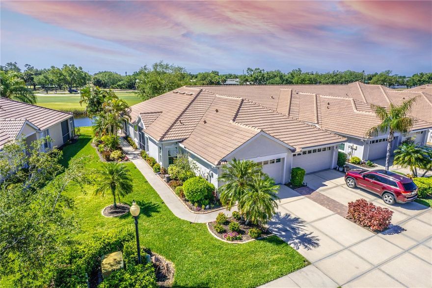 THIS HAS IT ALL! NEW ROOF 2023, NEW A/C 2024, END UNIT, WATER & GOLF COURSE VIEWS (on the 12th fairway) and can you believe it - TURNKEY FURNISHED! Located in the award winning community of Pelican Pointe Golf & Country Club, this villa is waiting for its new owner. IF that's not enough, all windows have been replaced with thermal pane hurricane resistant glass. Hurricane protection for the front door and lanai. The lanai is newer (2021) with heavy duty screens, expanded and a new paved floor. Newer Stainless Steel appliances complete the kitchen and new luxury vinyl flooring is in the bedrooms and office. The den/study has built-ins plus a Murphy bed. Crown molding in living areas and bedrooms. Having guests is a breeze with the split bedroom plan to ensure privacy for everyone! With all that this villa has, even the 2 car garage is great with a beautiful epoxy floor. Maintenance free living at its best! Exterior painting (painted in 2025) and roof replacement/repairs are some of the items included in the HOA fees as well as internet, basic cable, ground maintenance, and pest control. As a resident of Pelican Pointe, you will have access to lifestyle amenities including a clubhouse with bar/grille (enjoy Happy Hours at the bar), restaurant, fitness center, BRAND NEW DEDICATED PICKLEBALL COURTS, tennis and a heated lap pool. 24 hour guard gate at the main entrance and back entrances for residents only. Semi-private 27 hole golf course and golf is NOT MANDATORY. Wonderful biking, walking and pet-friendly community. BONUS: In addition to the lap pool by the clubhouse, there is also a community pool just around the corner for The Links residents only. EXTRA BONUS: There is a very active women's association with over 40 clubs. Only minutes from the Gulf, this villa is ideally positioned to enjoy the beaches, quaint shopping, cafes, restaurants & cultural activities of historic downtown Venice. Very accessible to I-75, US 41 and 4 airports. What are you waiting for?