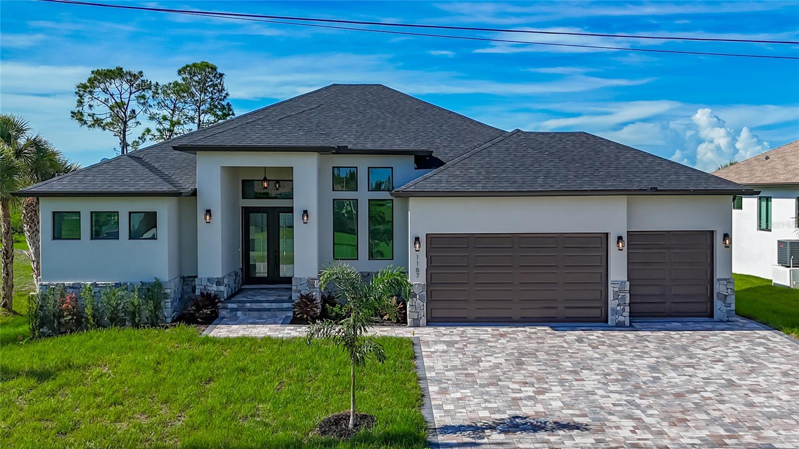 **LUXURY CUSTOM HOME***NEW CONSTRUCTION*** Friendly, warm and well maintained neighborhood of Rotonda West is the perfect location for this beautiful custom home! This house features: 3 bedroom, 3 full baths, office/den room, high ceilings throughout the house that range from 10 feet to 16 feet high, tray ceilings, luxury vinyl plank flooring throughout all common areas and bedrooms and tile in bathrooms, all 8-foot doors in the interior of the house, hurricane impact windows and sliding glass doors, calacatta quartz counter top surfaces throughout the whole house. Kitchen spreads a nearly 10 foot long and 4 foot wide quartz waterfall kitchen island with a large farm sink. Calacatta quartz slab is featured as a kitchen backsplash to keep the flow of the design. Kitchen is also equipped with exhaust fan, pot filler kitchen faucet over the range, under cabinet lighting and 63 inch tall kitchen cabinets. Spacious master suit offers sliding glass doors with an entry to the pool area, tray ceilings with lighting, one large 10x8 foot walk-in closet and another smaller walk-in closet for all your wardrobe needs. Master bathroom includes walk-through shower with mezmorizing tile work, free standing tub, separate toilet closet, dual sink vanity, private windows for plenty of natural lighting! Expand your indoor living space by opening fully retractable zero corner sliding glass doors in living and dining room area with a view of lanai and the pool. Enjoy 27’ by 11' large covered lanai space equipped with outdoor kitchen, which include: grill, kitchen sink, fridge, exhaust fan, tiled wall, electrical outlet and ample counter space. Take a splash in a 30 foot long salt water, heated pool with water fountain feature and LED lights. Also comes with jetted jacuzzi and outdoor/pool shower. Entire lanai area is finished with outdoor tile flooring. The back of the lanai is wooded area and feels very private but voluminous. House sits on 1/3 of an acre oversized lot and offers wide tiled driveway to a 3 car garage. Garage has epoxy floors. This house is tastefully designed and skillfully build and would make a wonderful and comfortable home!!!! Short drive to the stores, restaurants, shopping, parks, beaches and all necessities of life! Come and see…!!!