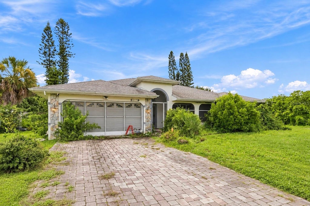 Photo of 23179 Avacado Avenue, Port Charlotte, FL 33980 (MLS # D6148737)