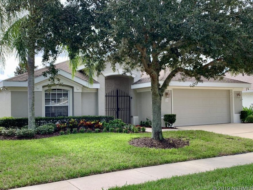 Live in one of the best locations in Port Orange.  Royal Palm is a gated, maintenance free community with a 12,000 SQ FT clubhouse loaded with amenities. The home has brand new carpet, two bedrooms and bathrooms in the main structure and a third bedroom with bathroom in the front of the home separated by a paver courtyard.  It is perfect for the extended family member, teen or as an office.  Inside, the eat-in kitchen has NEW granite counters, sink and stainless appliances and is large enough to host holiday meals.  The screened in lanai is the same width as the house and overlooks a beautifully maintained pond where you often see otters and ducks swimming by. Glass doors in the living room and master bedroom open up to the lanai and glass doors in the master bedroom also open up to the courtyard.  Inside laundry, 2 car garage, New A/C unit installed 2 years ago. The master bathroom has a large shower, jetted garden tub, private toilet and double sinks. Large shared walk in closet. HOA paints your house every 5 years and washes the exterior every year along with lawn maintenance. With a full activities schedule, heated pool, fitness center, tennis courts, billiards room, craft room, full kitchen and dance floor at the clubhouse only a short walk away, what more could you want? ;Water: City