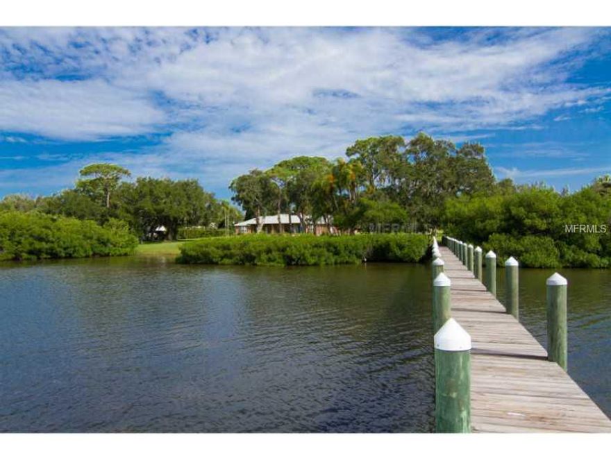 Discover the inspiring possibilities for this unique estate, beautifully set on over 12 acres on Palma Sola Bay in Northwest Bradenton. Upon approach, a glimpse of the shimmering bay emerges through a rich canopy of trees, welcoming you to your grand country escape in the city. An expansive front porch sets the perfect tone for the home's seamless blend of tradition and comfort, where time-honored standards of construction have created the framework for an incredible estate built to last. Existing designelements include exposed brick accents, wood beams, beautiful wood floors, crown molding and a charming fireplace, while breathtaking views of Palma Sola Bay can be enjoyed from almost every room. An elegant patio and impressive grounds provide the ultimate setting for the addition of a private bay front pool, with ample space for constructing a separate guest house, if you so desire. This truly special property presents endless opportunity, enveloped in privacy yet only minutes from Robinson Preserve, the city and the beautiful Gulf beaches.   Total acreage includes parcels #7331315109 and #7331315159.  Parcel #7331315159 includes a 3 bed/2 bath block home, built in 1978.