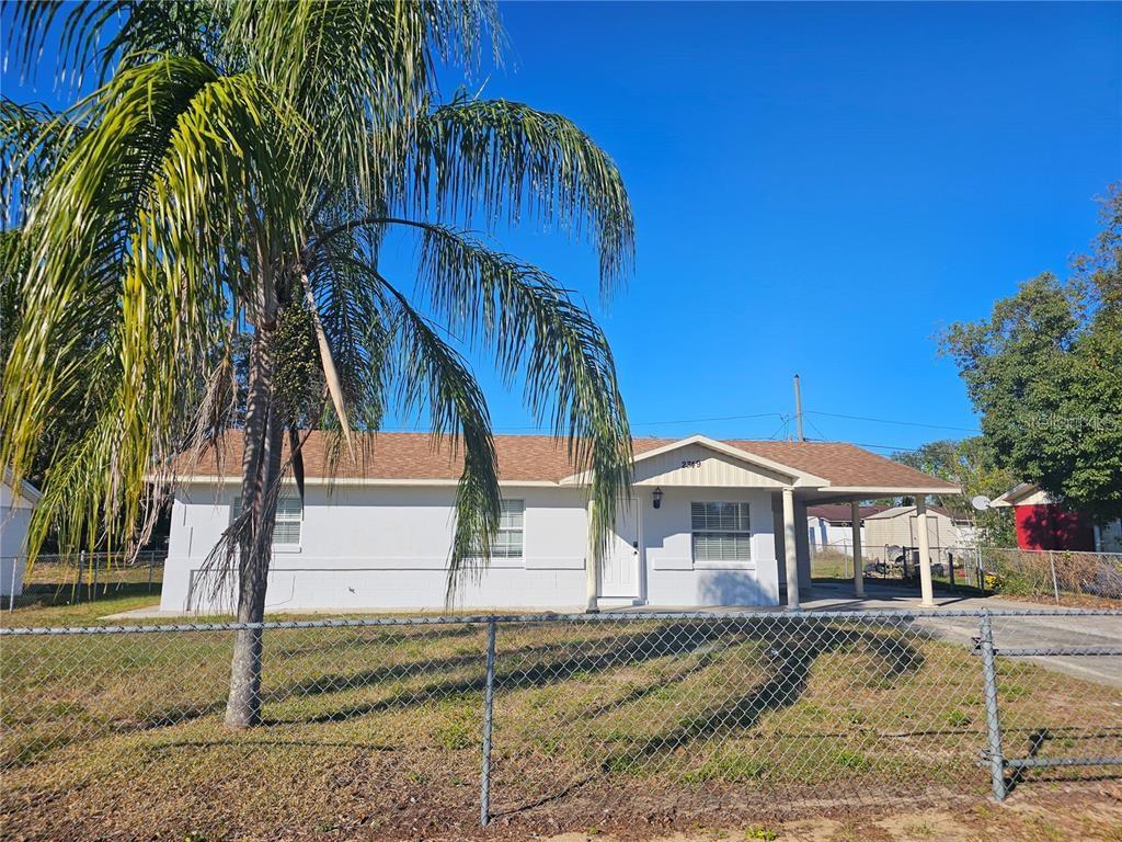 Enjoy living without an HOA. Completely remodeled home ready for you! This property has 3 bedrooms and 2 full bathrooms. It is fully fenced for added privacy. There is a carport that holds up to 4 vehicles. The inside is completely renovated with a new kitchen, new roof insulation, freshly painted, new laminate flooring, new bathrooms, and new appliances. The kitchen includes a cooktop, Microwave, Dishwasher, & Refrigerator. The inside utility room has ample space for your washer & Dryer. You would enjoy the large lawn space, great for entertaining and growing. This property is just minutes from Hwy 27 and minutes from State Rd 60 E. Located minutes away from hotels, pharmacies, shopping centers, restaurants, Bok Tower Garden, and so much more. Schedule your private viewing today.