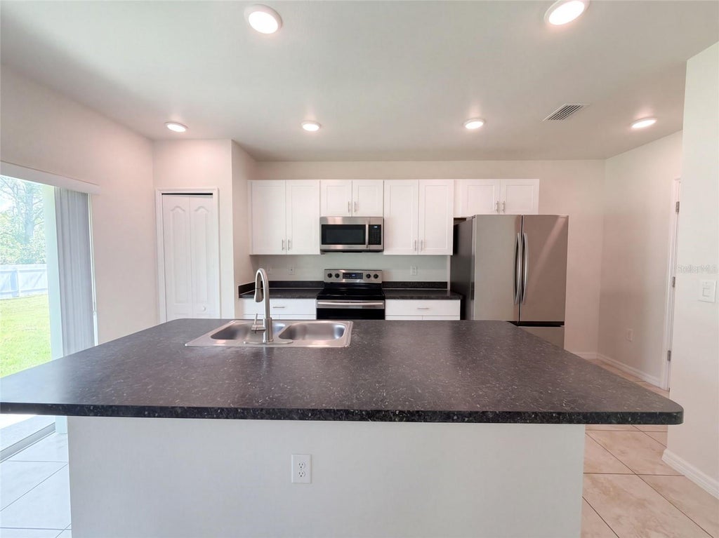 Photo of 370 Hyacinth Street, Port Charlotte, FL 33954 (MLS # O6448471)
